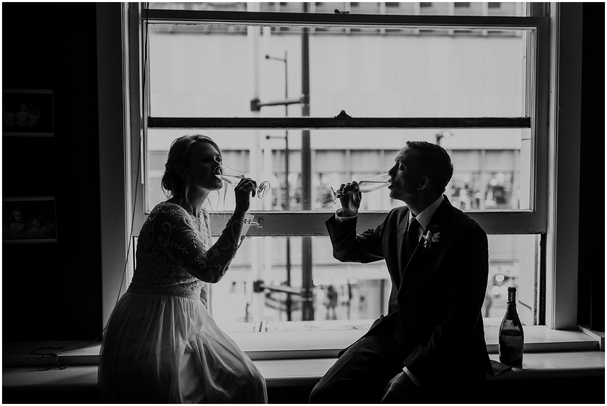 bride and groom champagne toast in vancouver block building