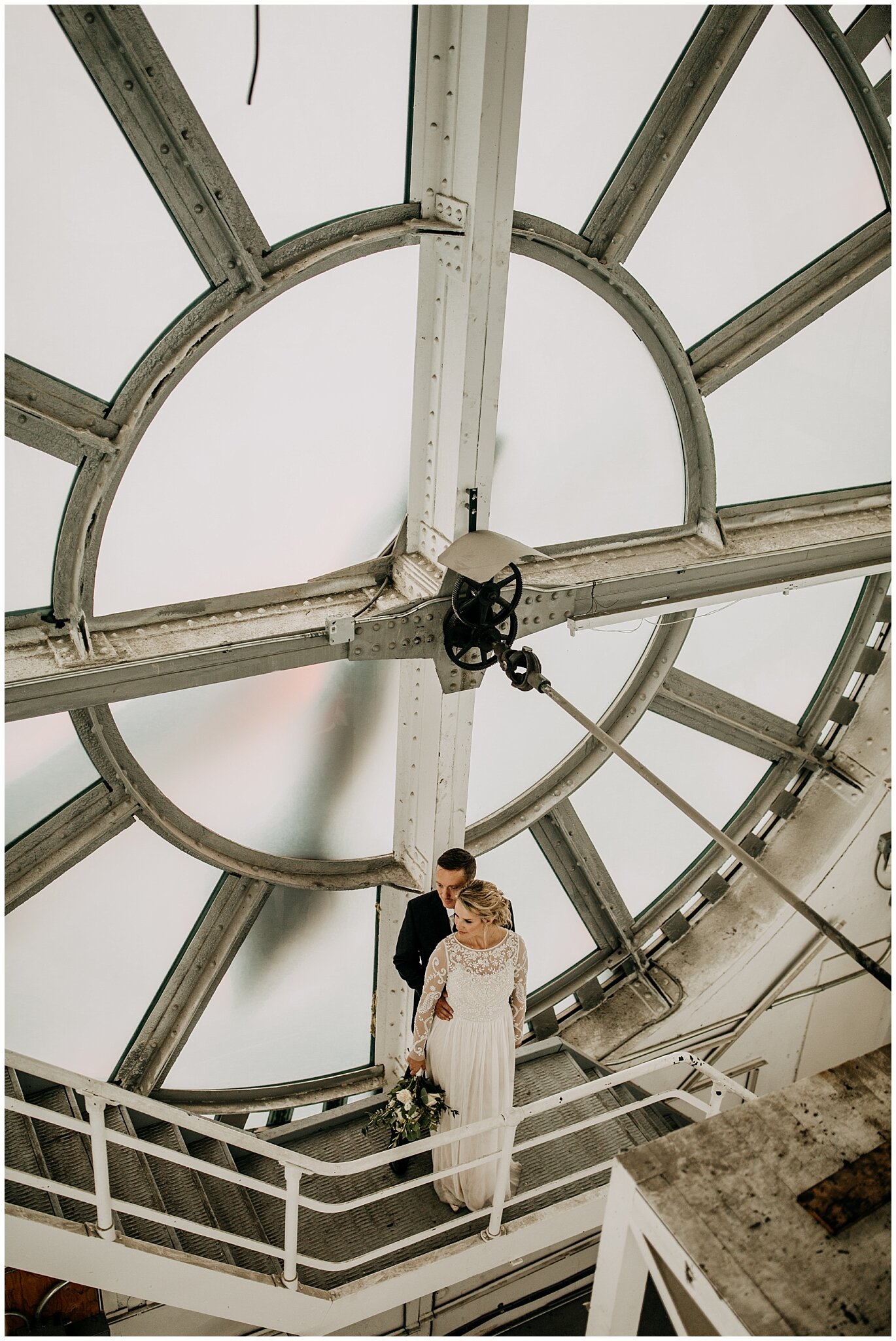 bride and groom portrait inside clock tower in vancouver block building