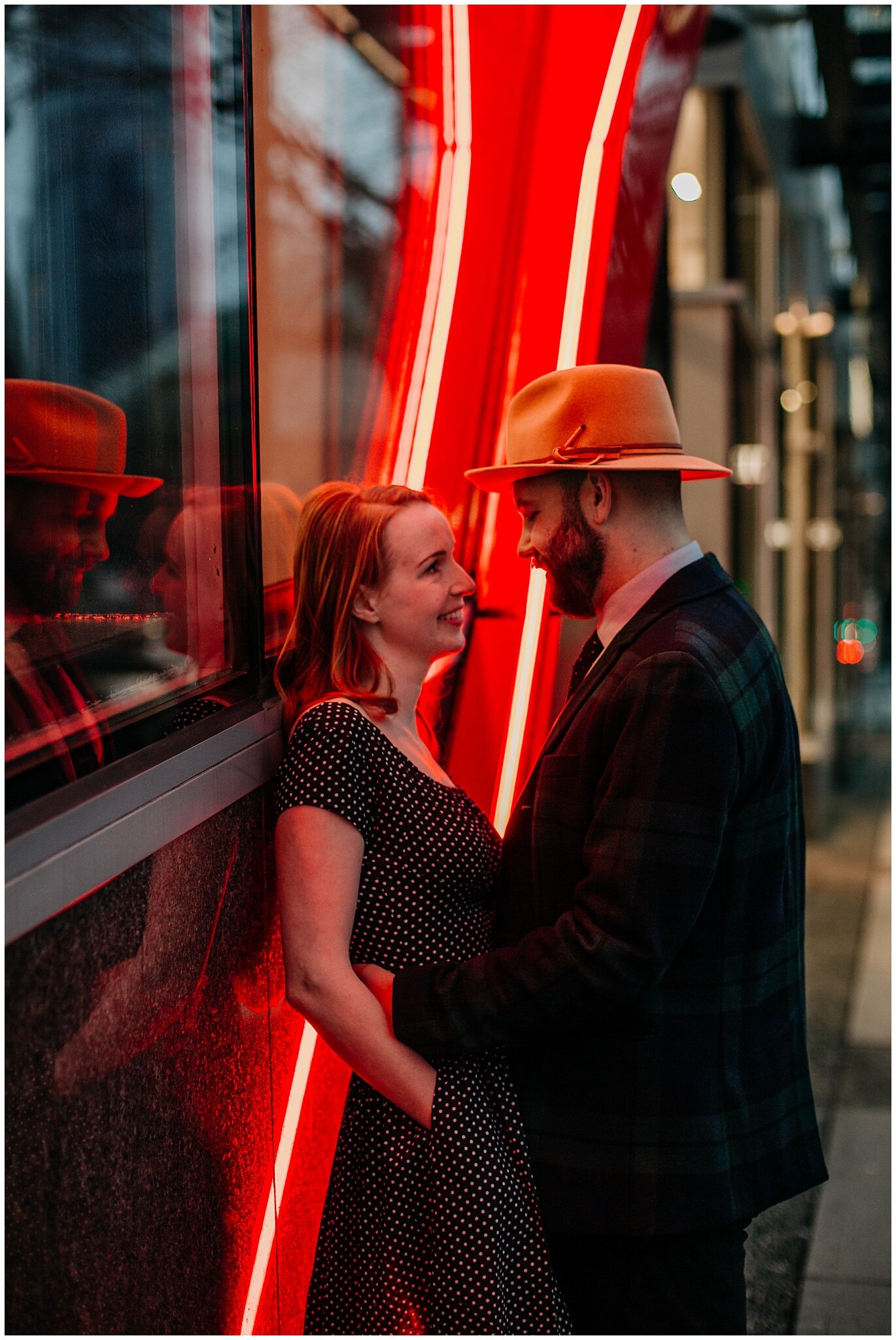 engagement photos with neon lights in downtown vancouver