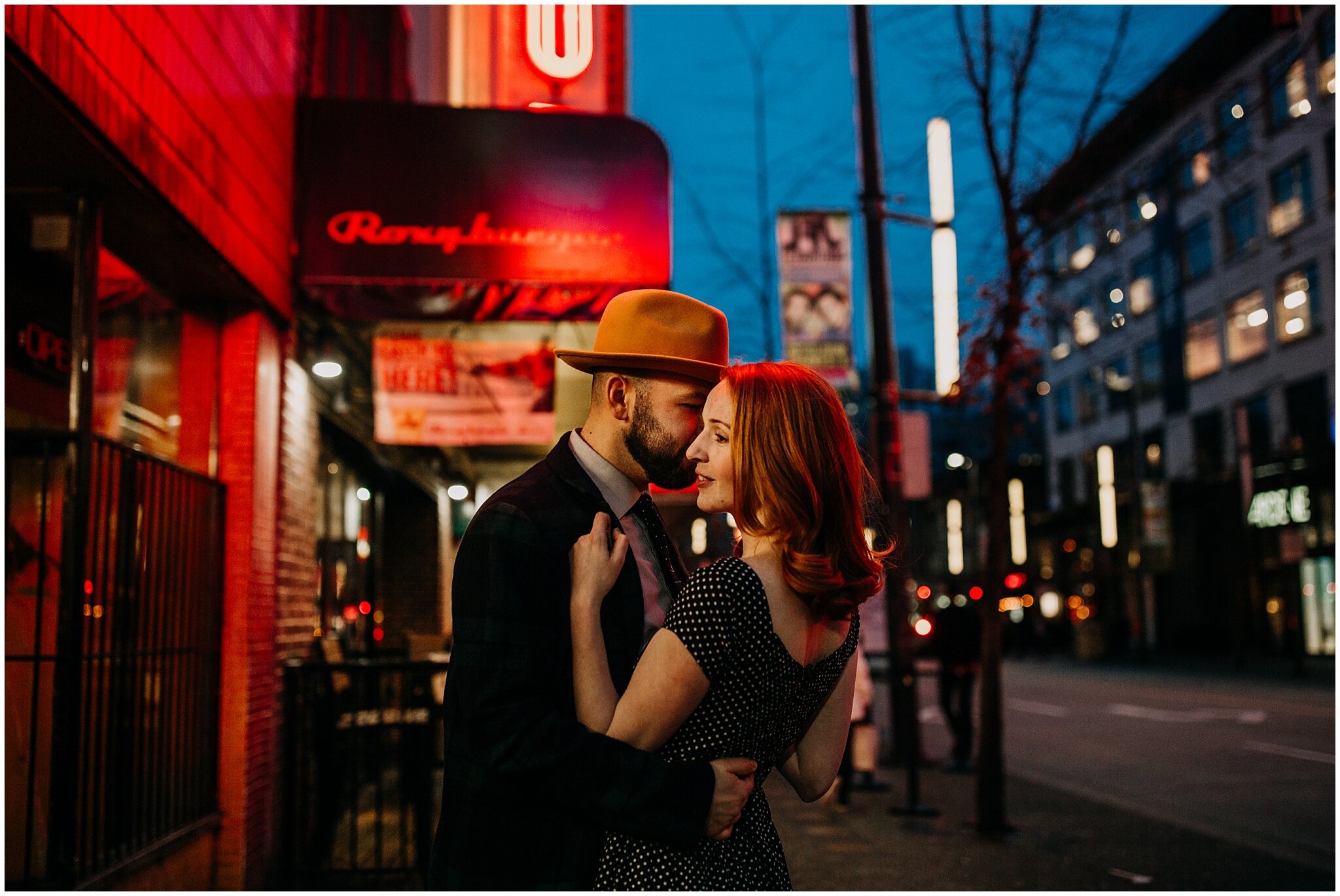 night time engagement photos with neon lights in downtown vancouver