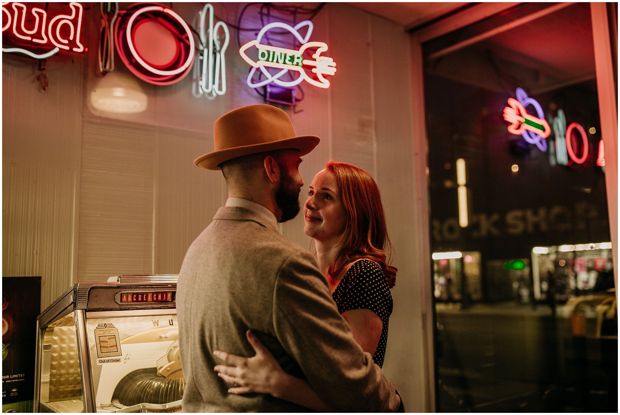 engagement photos with neon lights in the templeton downtown vancouver