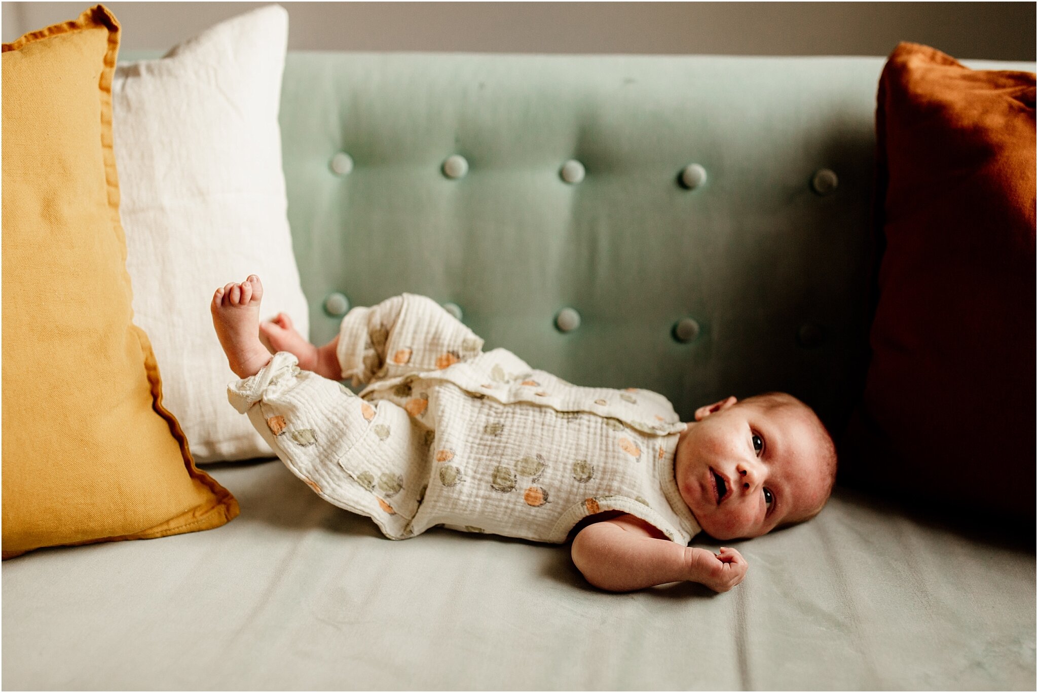 lifestyle portrait of baby on sofa in vancouver photo studio