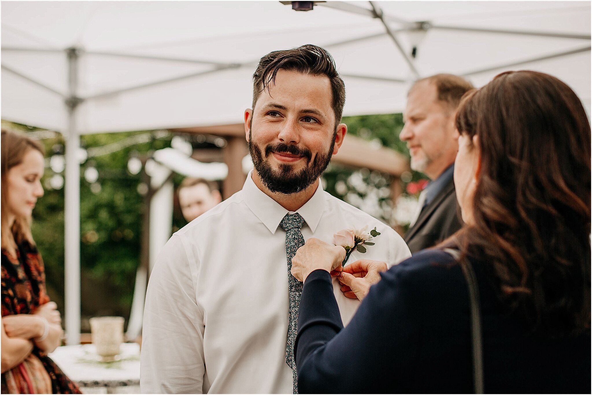 mom helping groom get ready in intimate backyard wedding Surrey BC