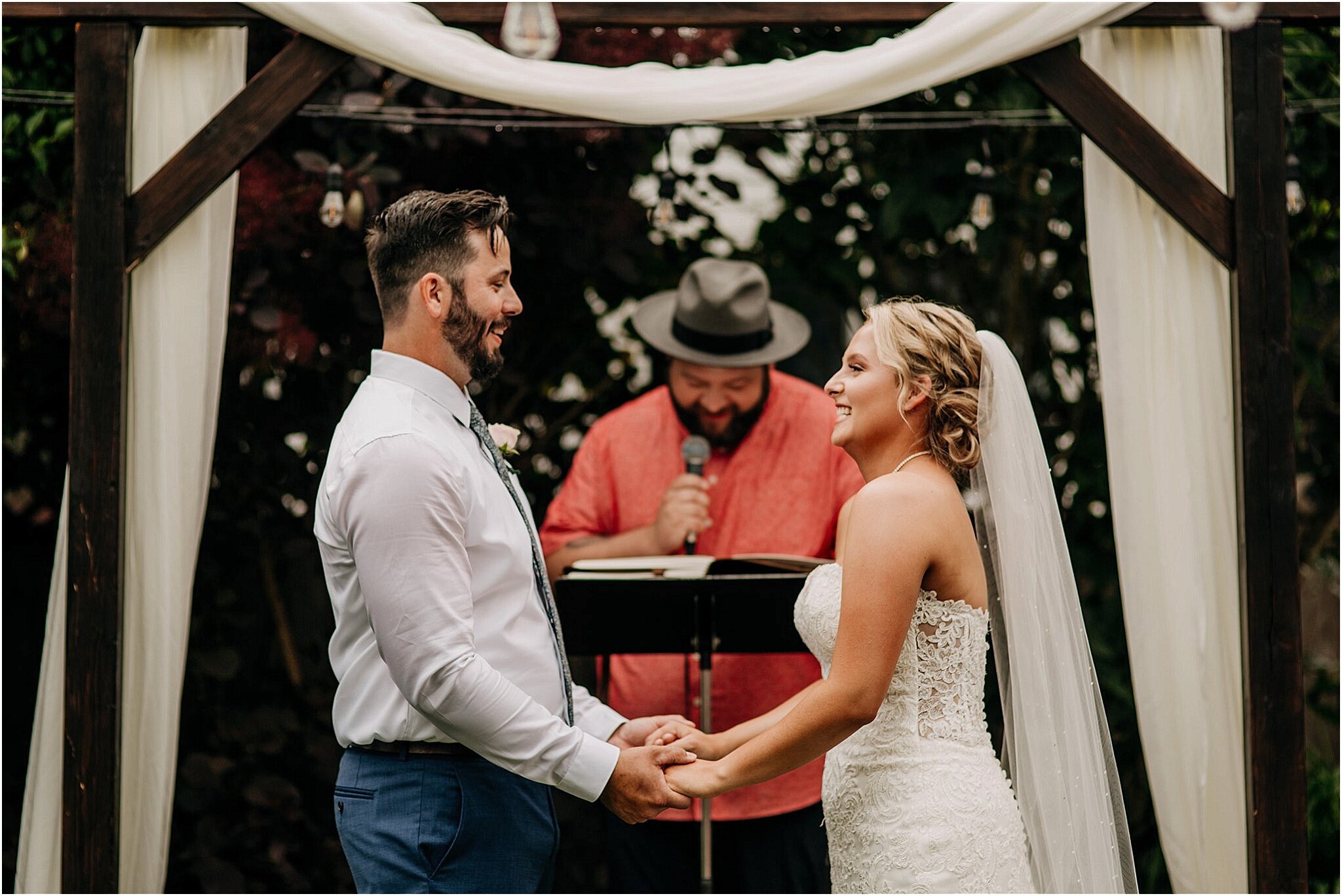 bride and groom holding hands in cozy backyard wedding ceremony Surrey BC