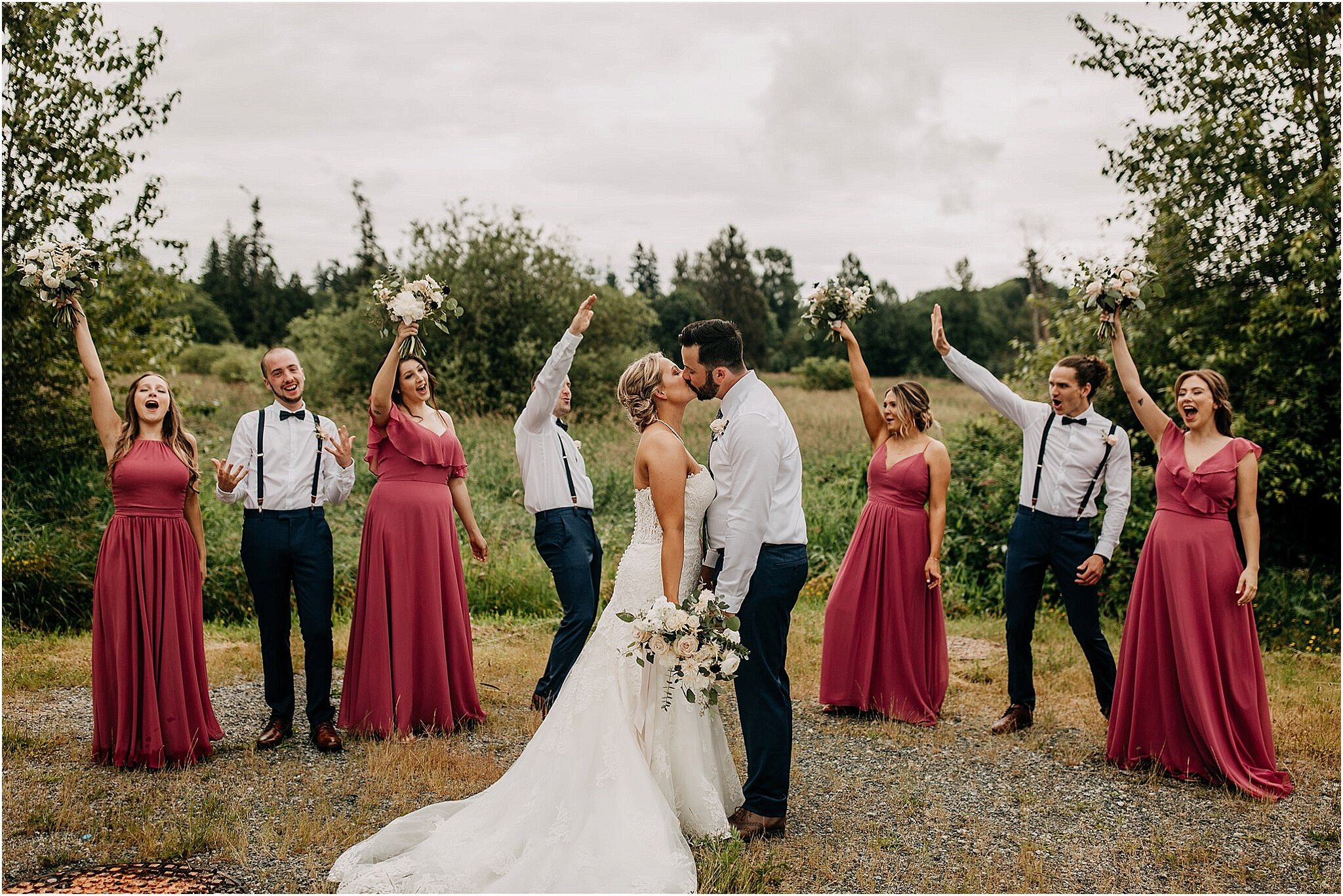 bride and groom kiss in wedding party portrait Surrey BC