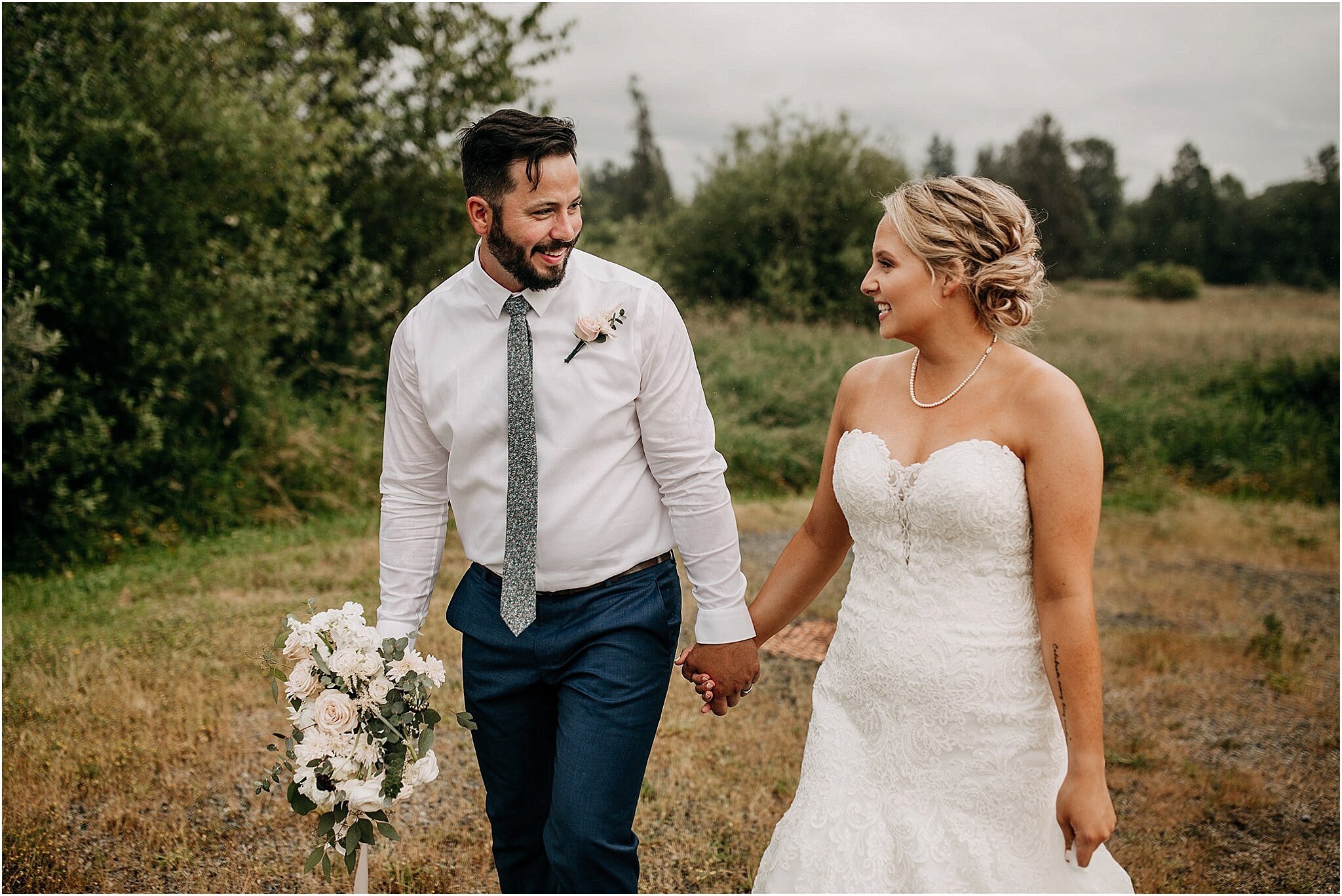 bride and groom laughing together holding hands Surrey BC wedding