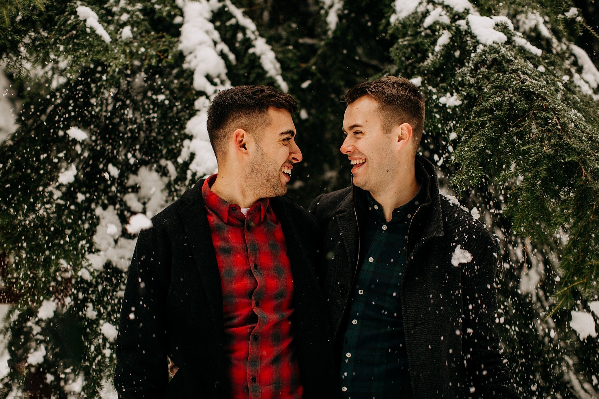 snow falling on couple at mount seymour engagement session