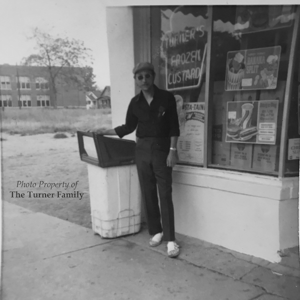 Mr. Turner in front of Turner’s Confectionary