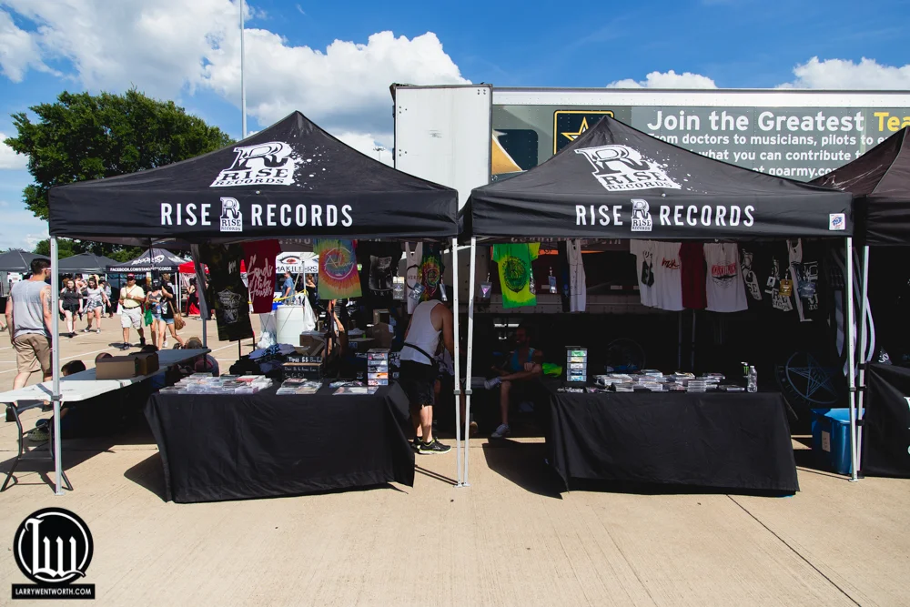 The Rise Records merch tents.