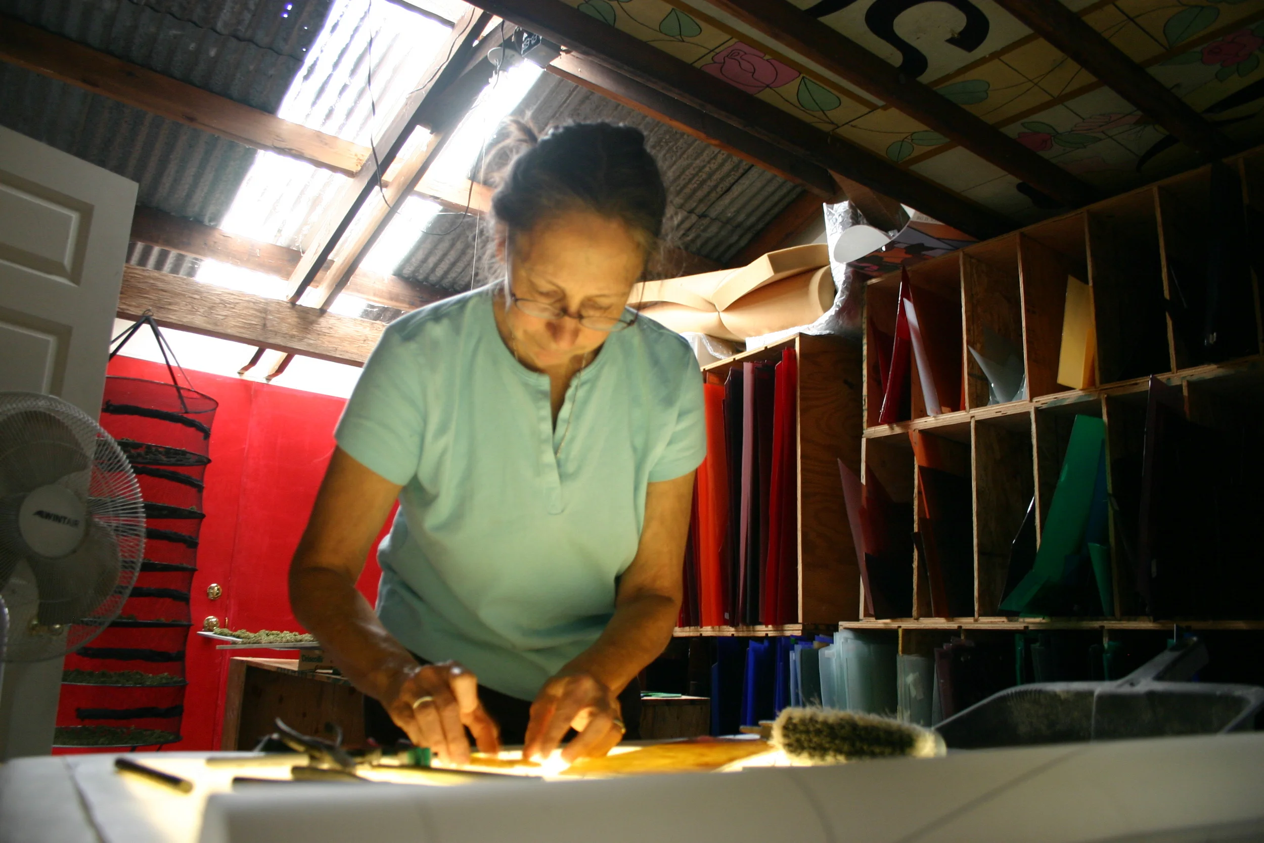  Michelle using the light table for cutting the dense colors. 