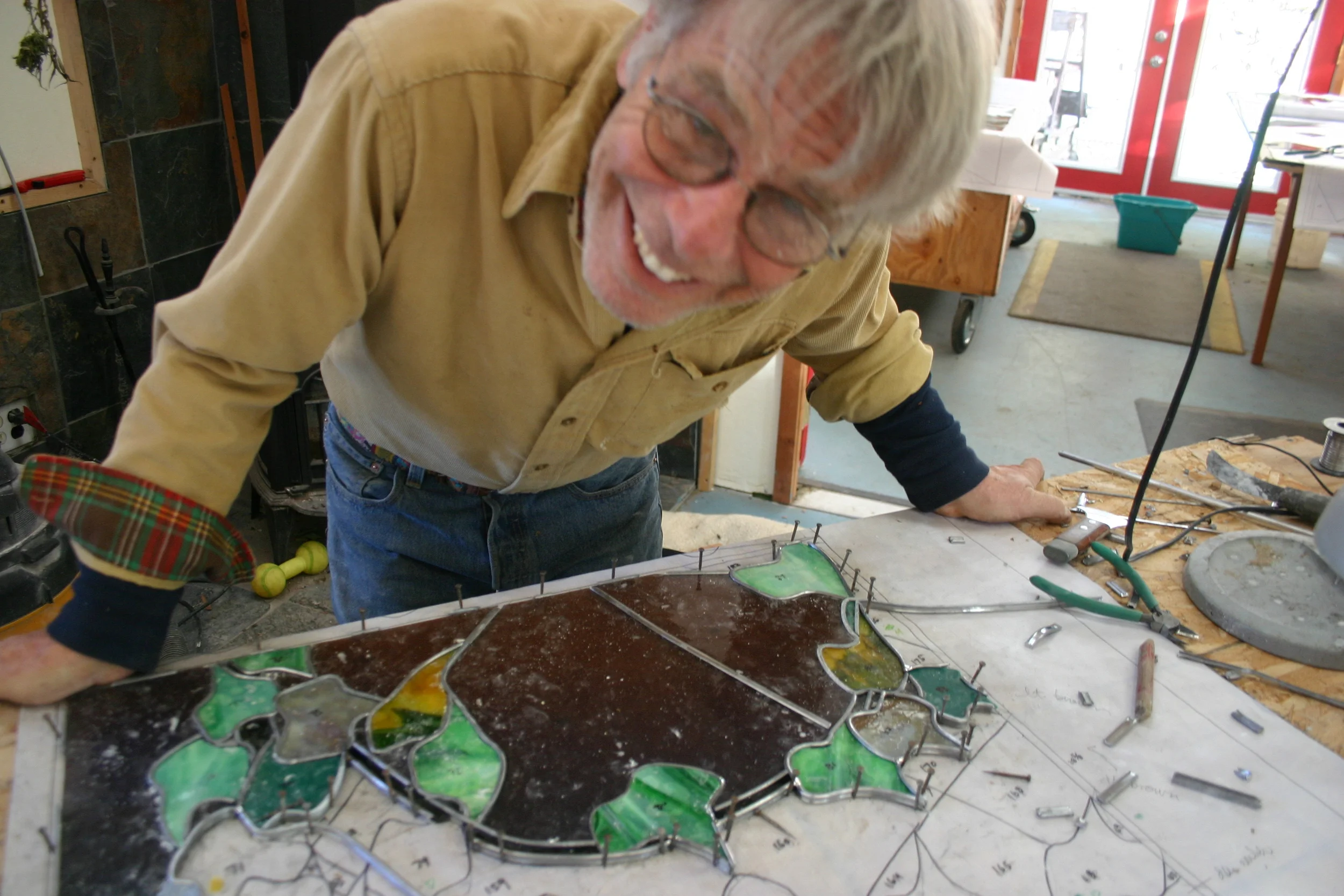  David pauses over a partially completed assembly. 