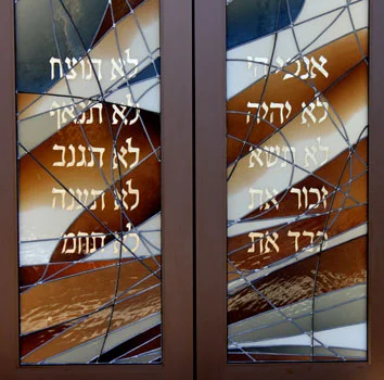 The gold leaf on a pair of completed ark doors.