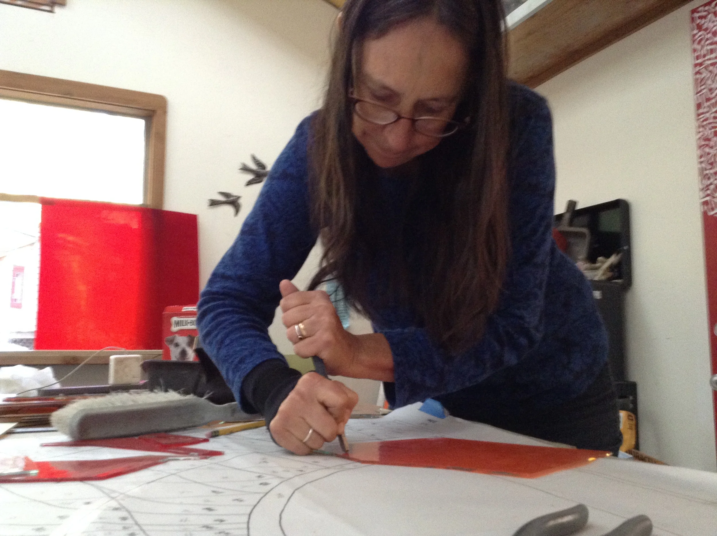  Michelle scores a piece of glass for the Holocaust Memorial Window. 