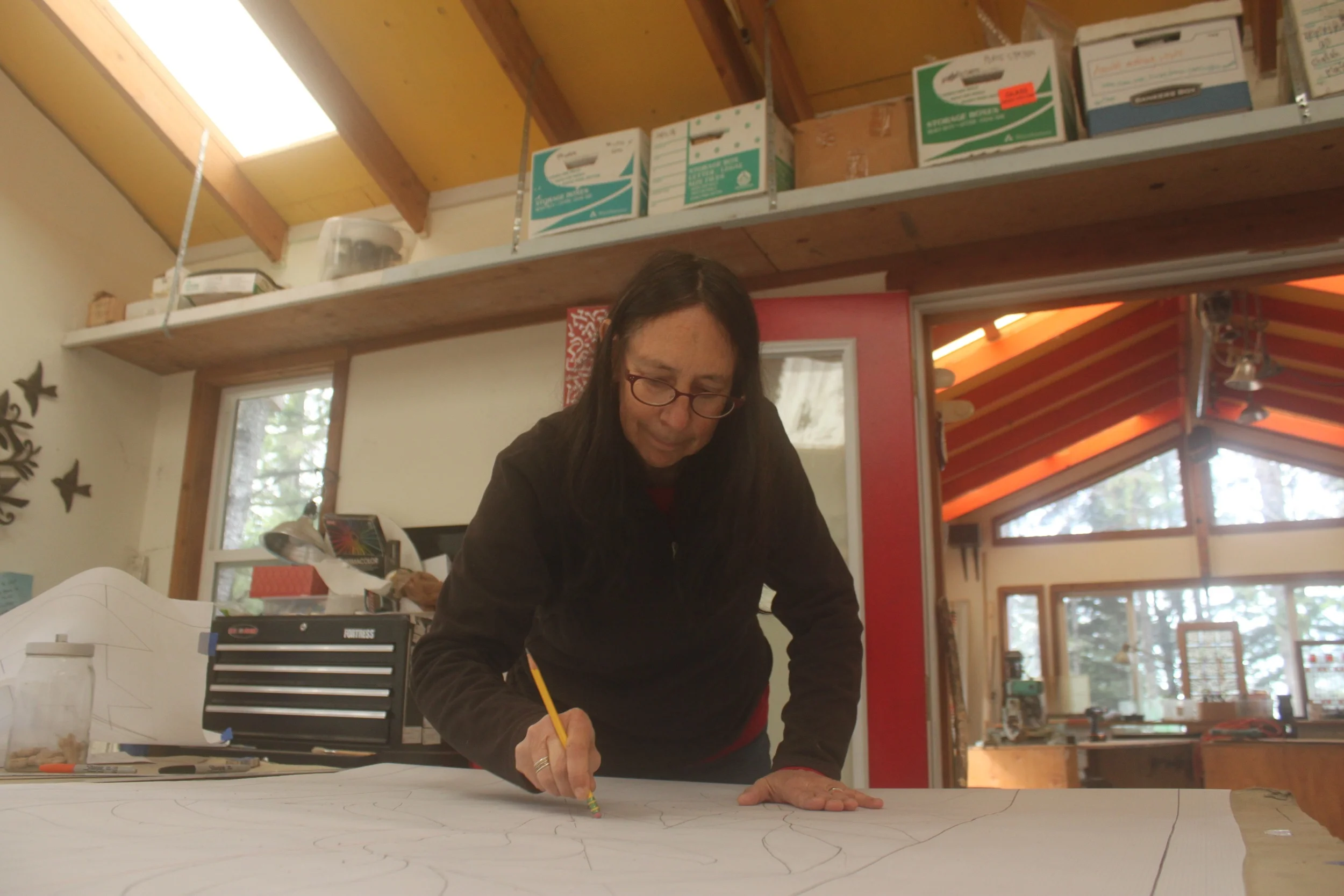 Drawing and erasing in the Sherwood Ranch Studio.