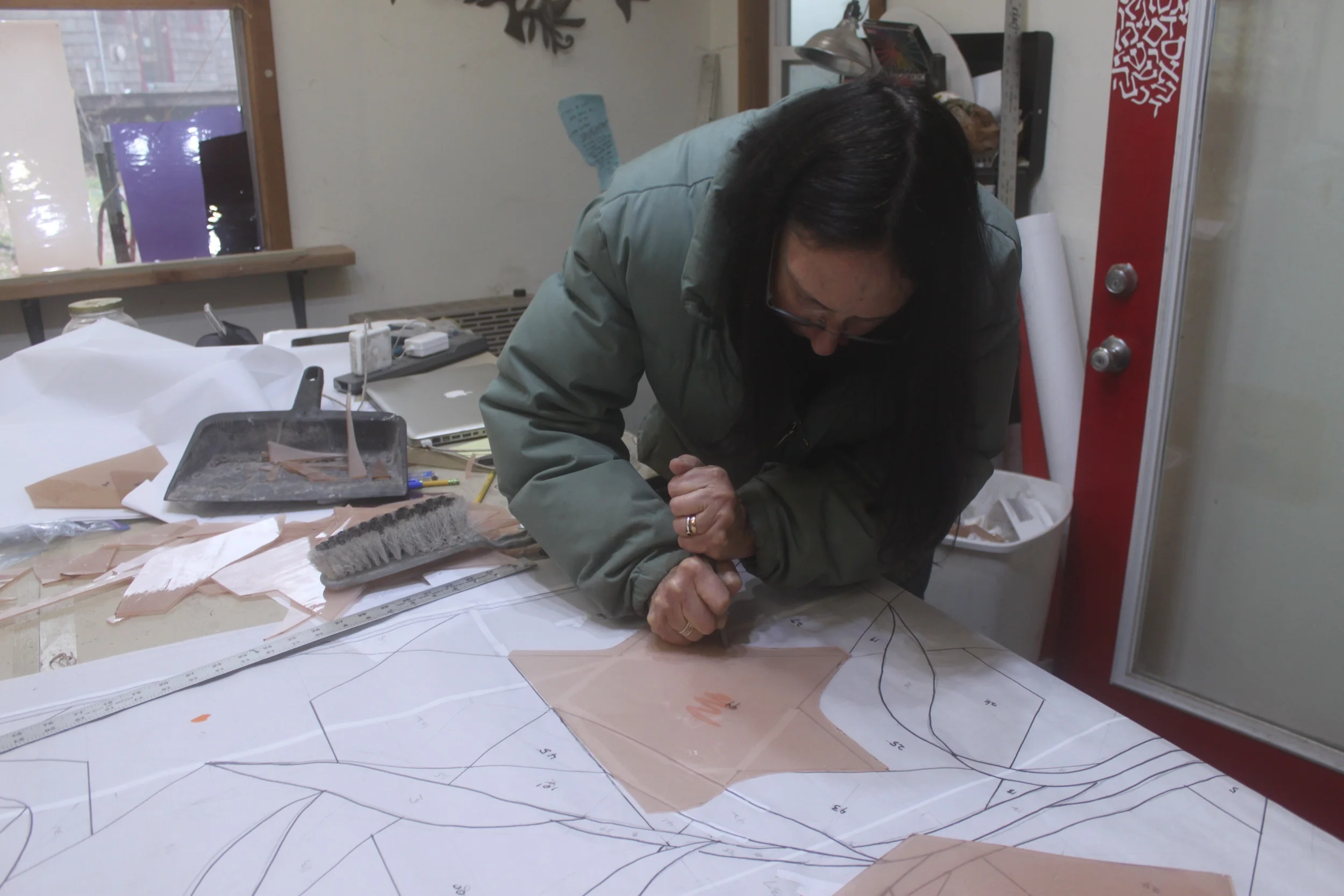 Michelle works on the difficult six-pointed stars first, to figure out what the best method is going to be to produce this complex shape in glass.