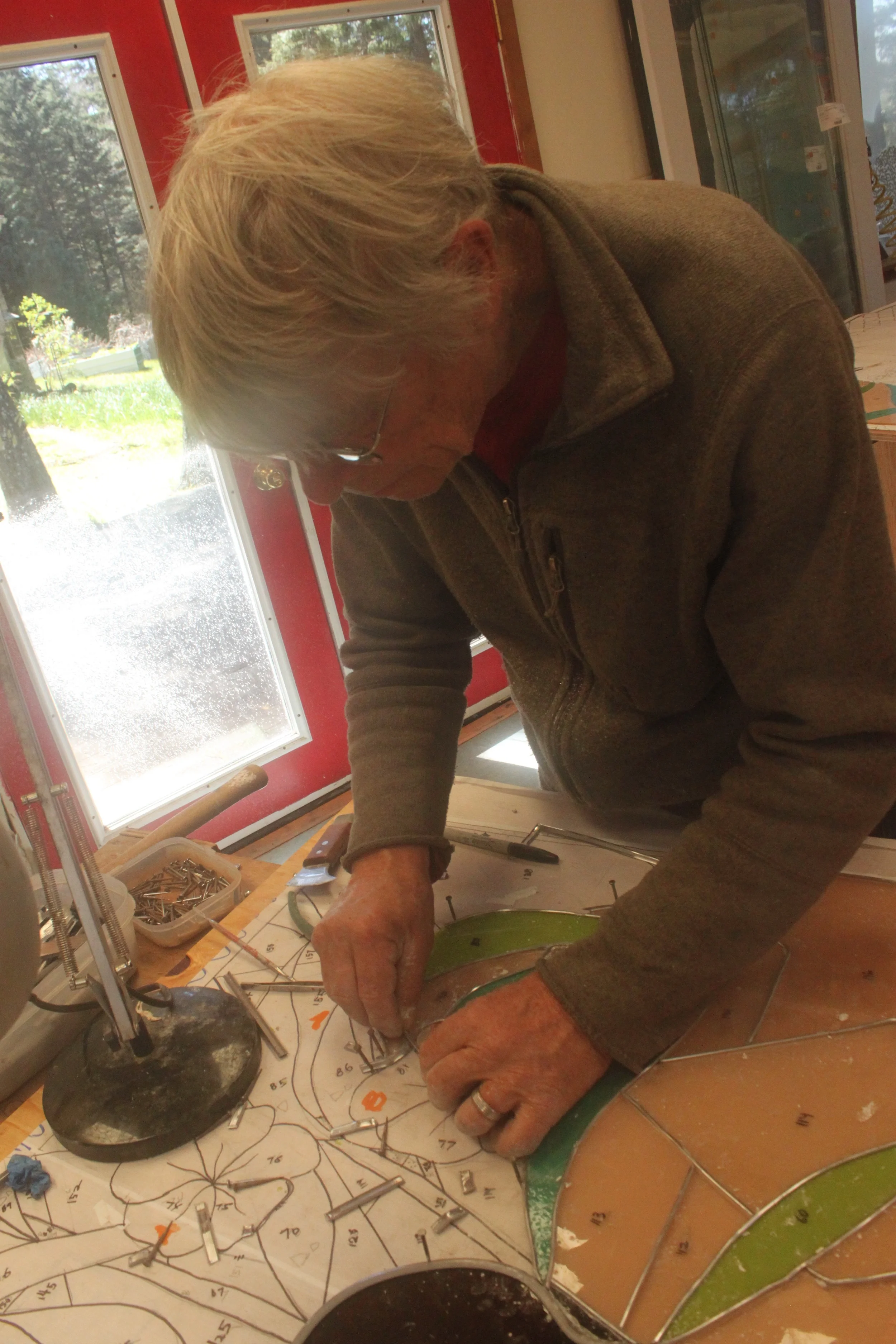 David works on an intricate section of the assembly of the first panel.