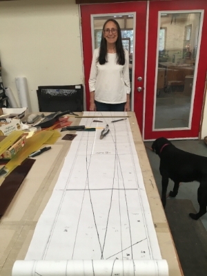 Michelle works on creating the full size patterns for the stained glass panels.