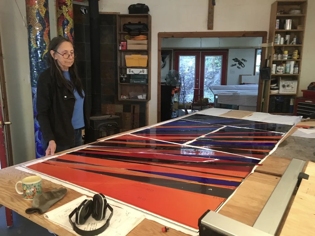Michelle checks the completed door for changes.