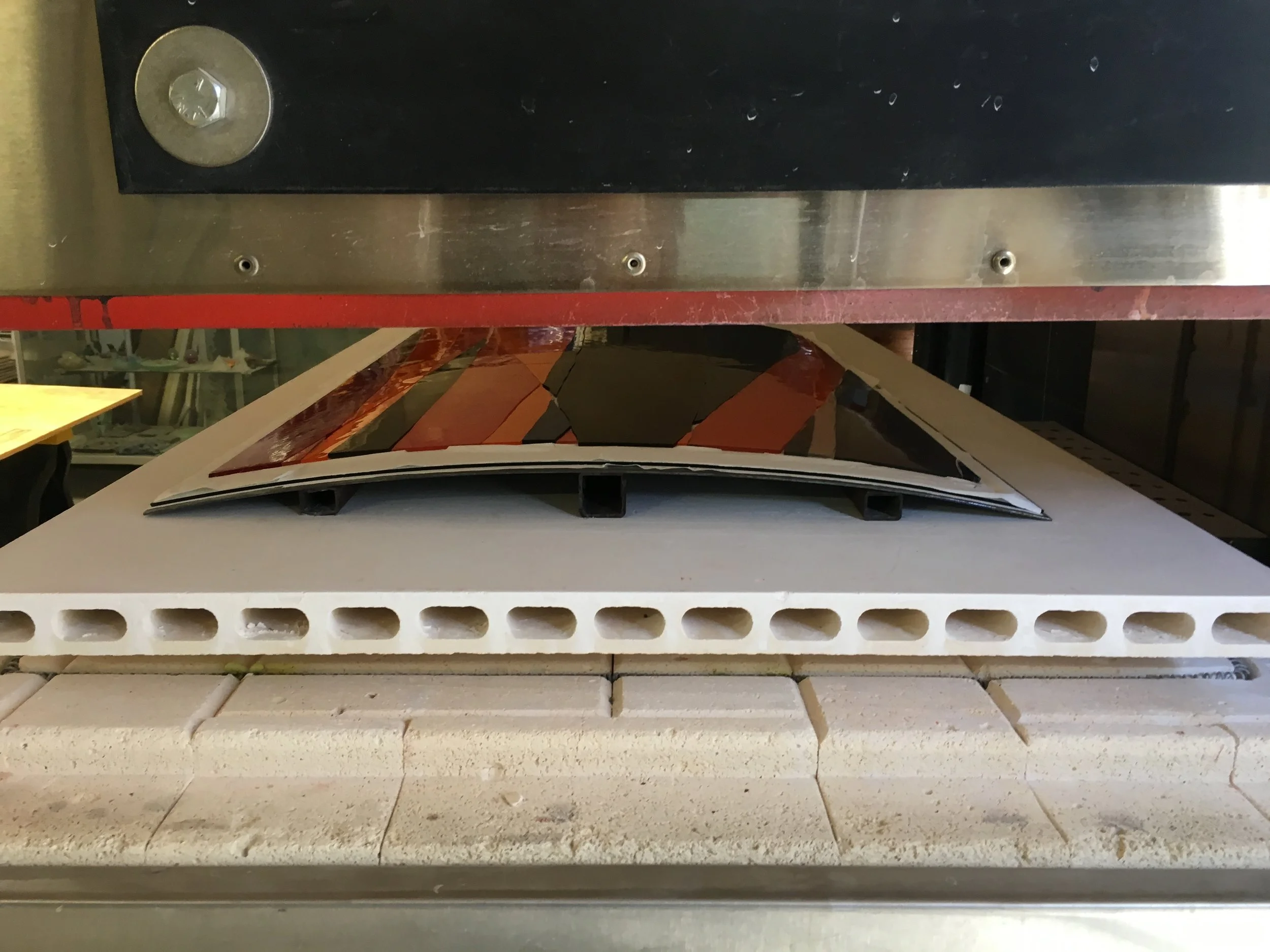  The last pieces formed to the specified radius cooling in the kiln. 