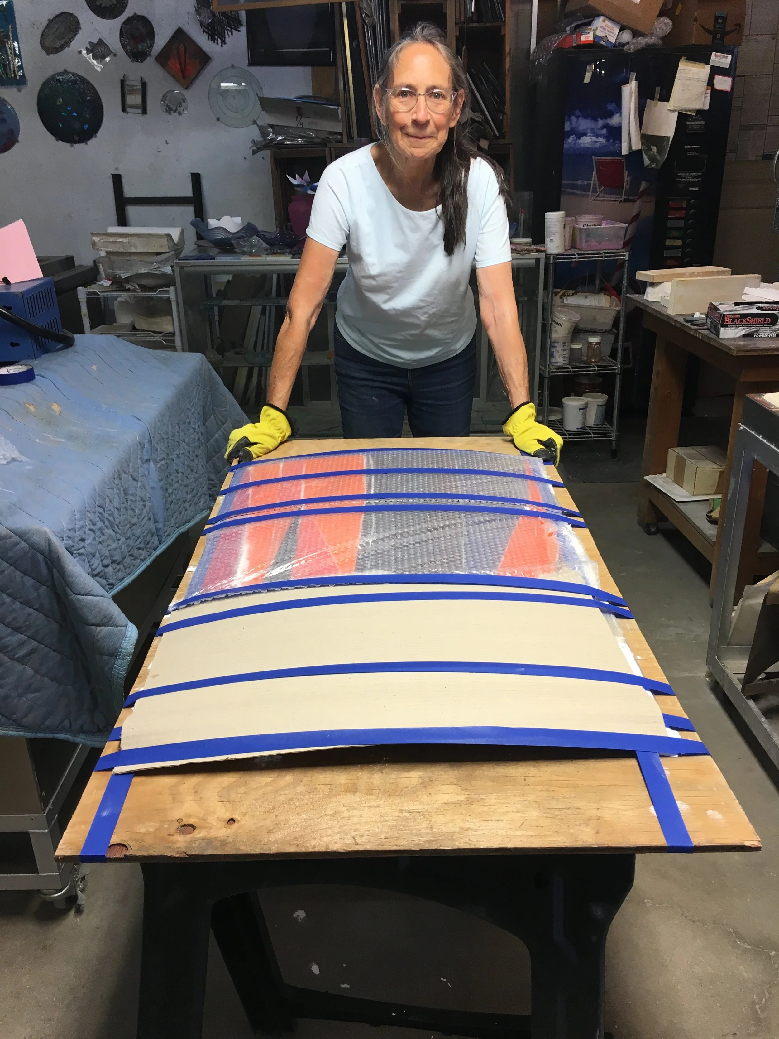  Michelle, ready to carry out the last panel, after firing the drop down kiln in Sacramento for the final time. 