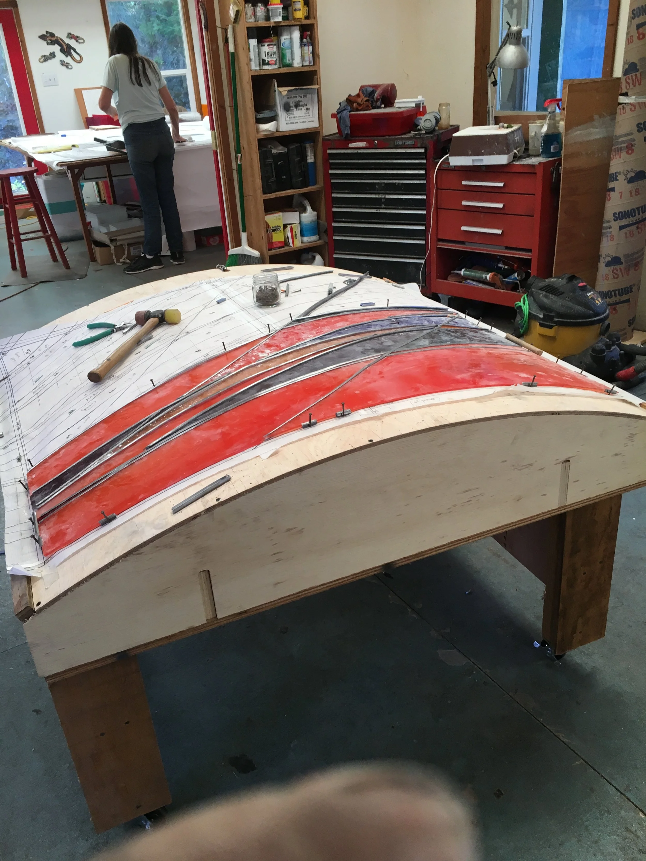  working on the assembly of the 48”  48” panel 