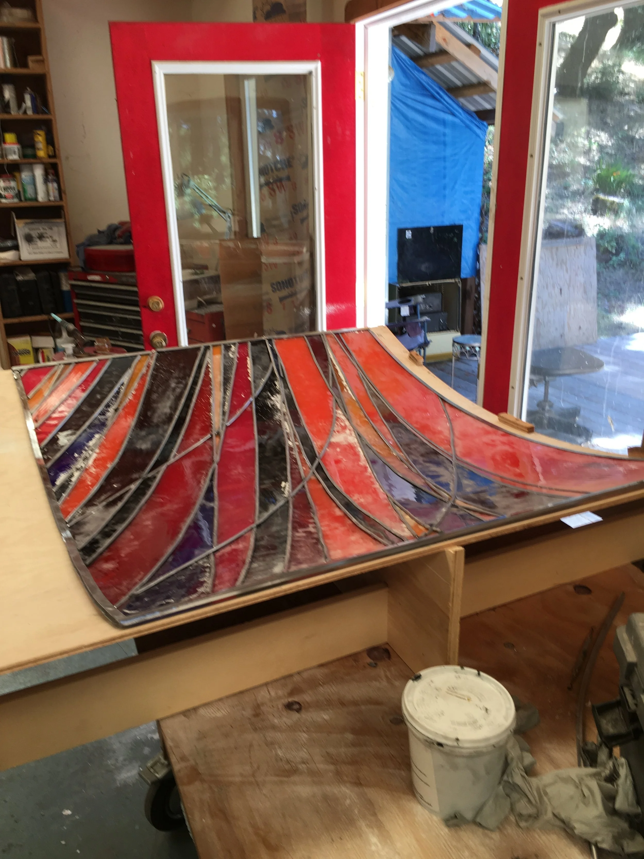  the 48” x 48” panel on the inverse board, turned over for soldering and glazing. 