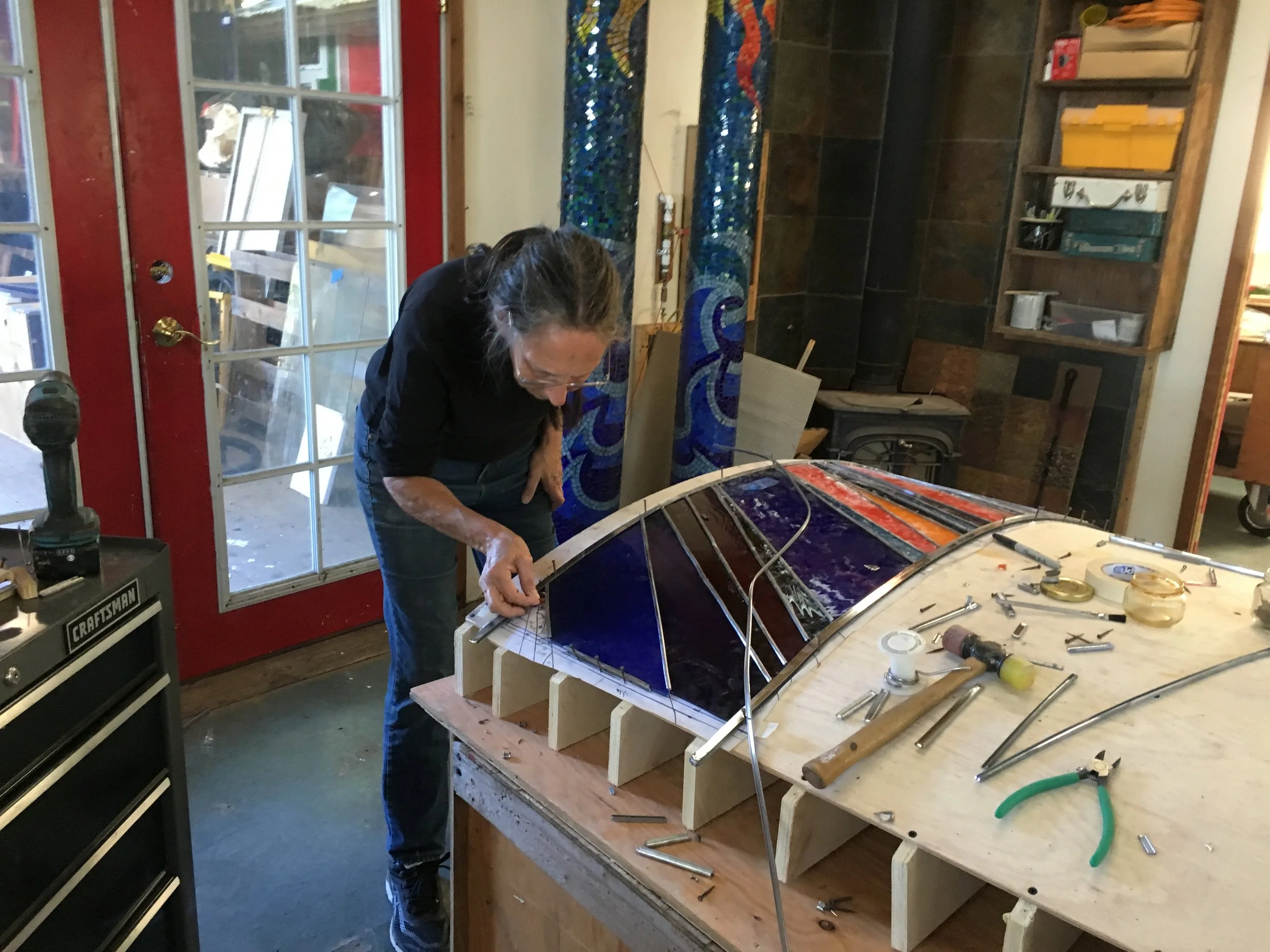  Michelle cleans a panel before being turned over to finish the back side. 
