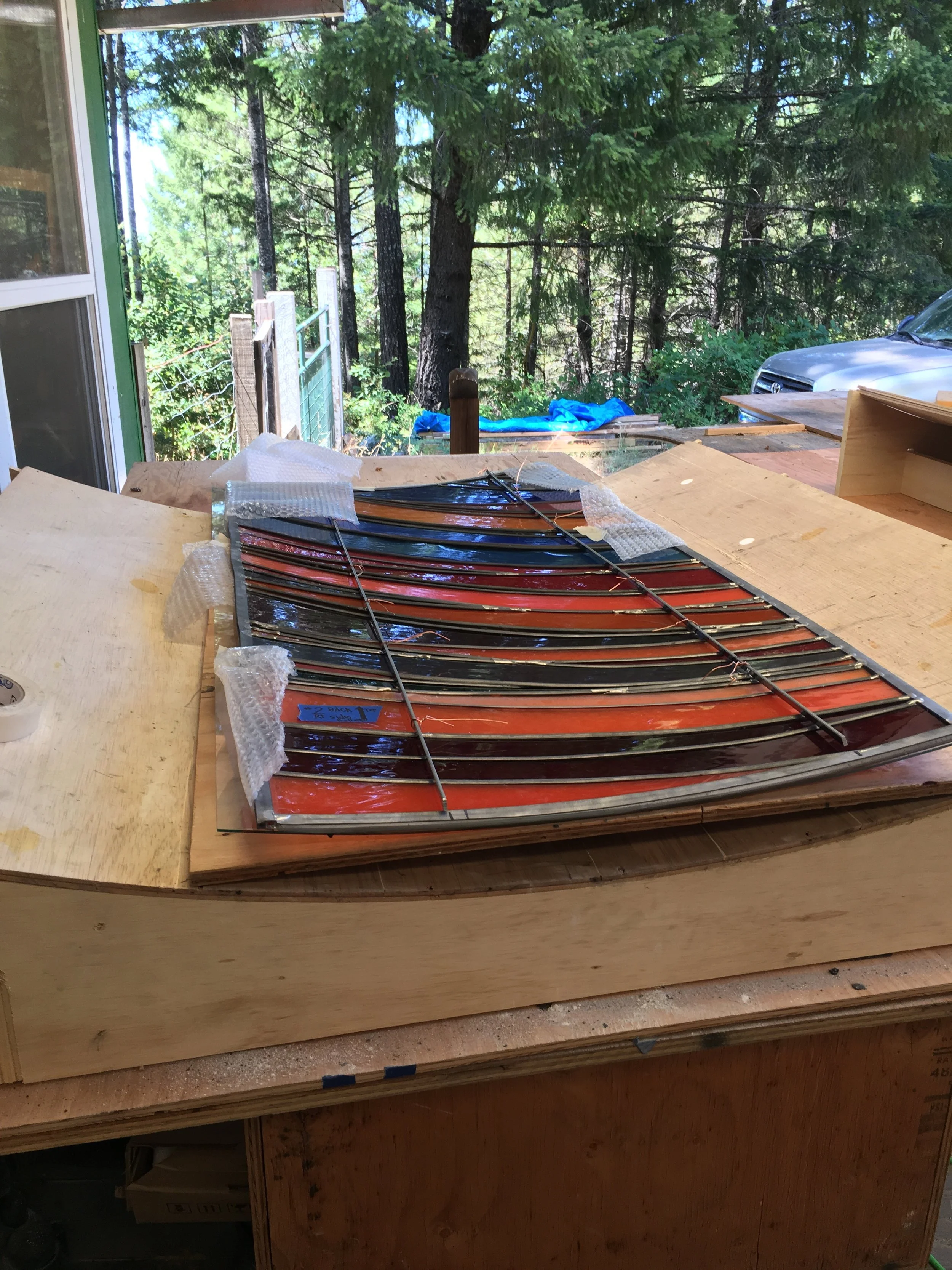  A window panel with temporary steel bars tied to the surface. 