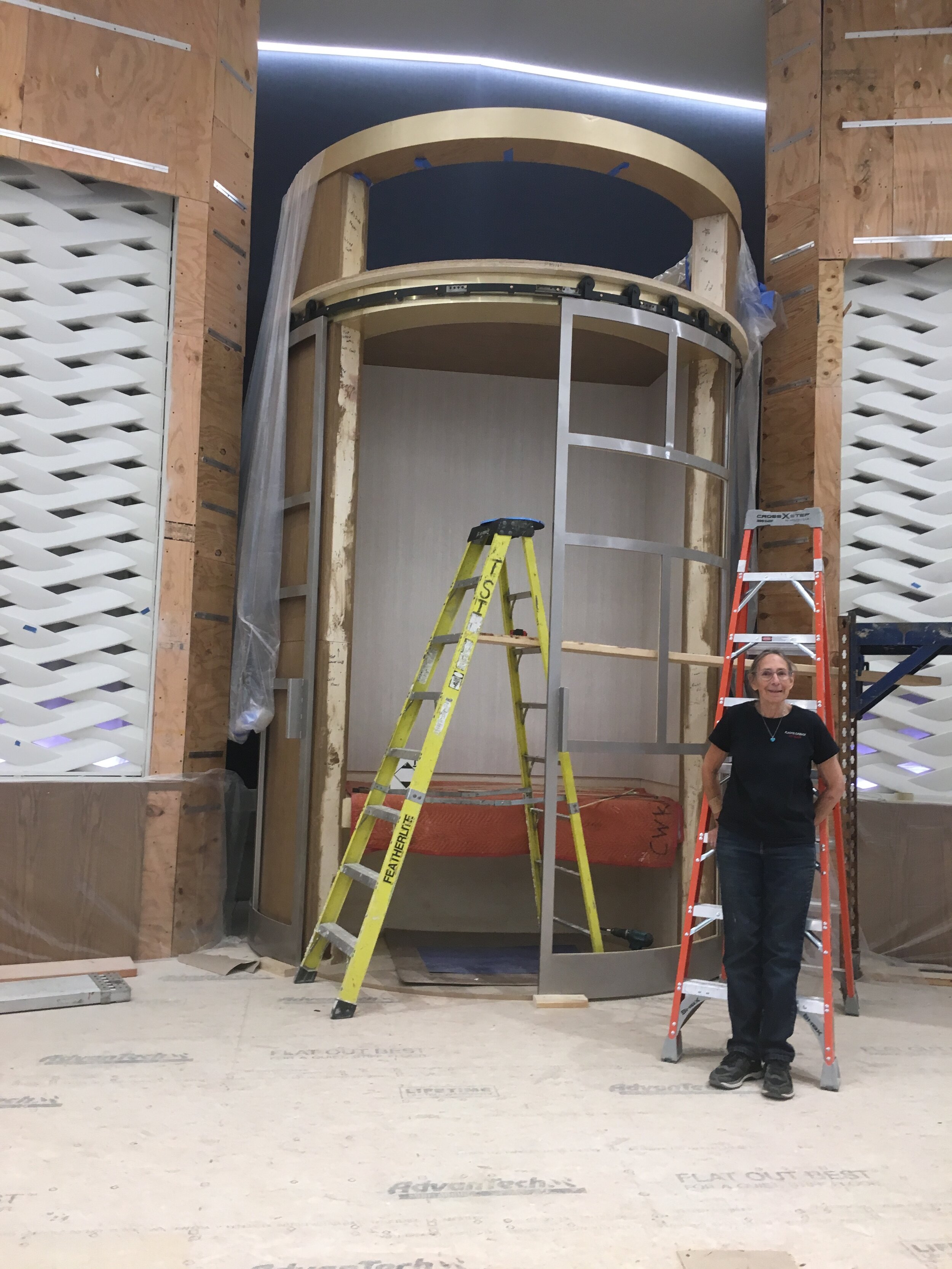  Michelle examines the ark doors prior to the beginning of the install of the glass. 