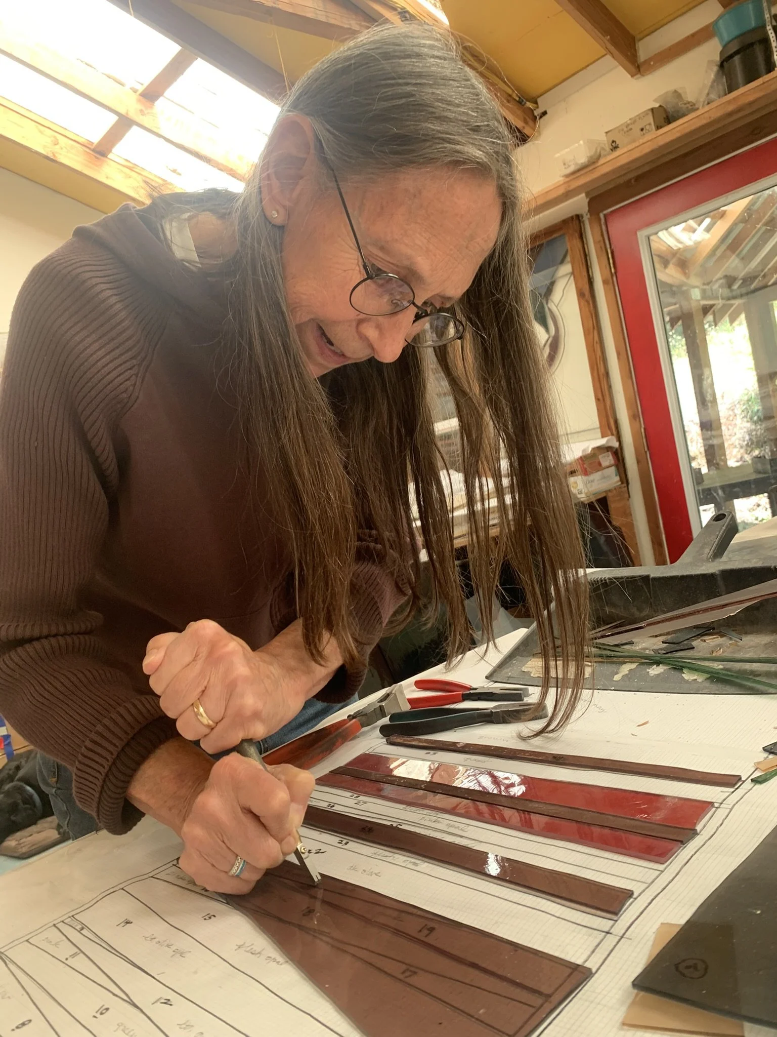Michelle cuts the final piece for Panel #8