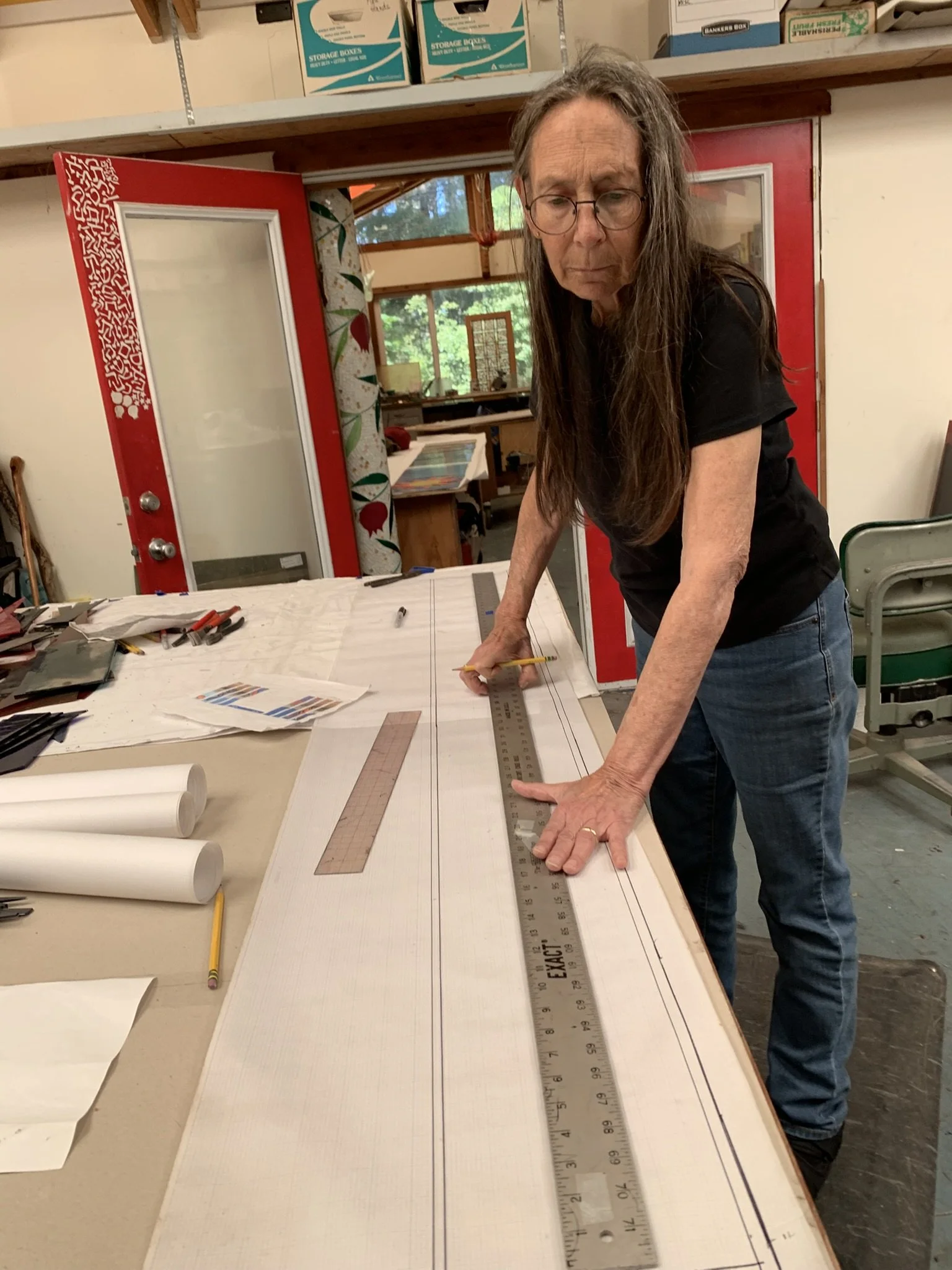 Michlle lays out the pattern for the transom window above the doors