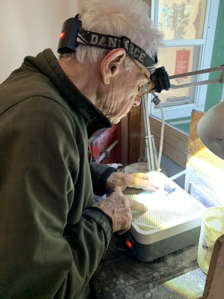  David works on the grinder fitting pieces during the assembly 