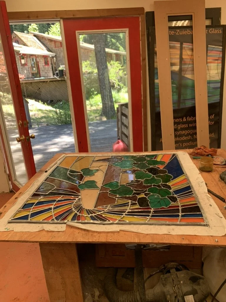  The first panel is glazed and cleaned on the front side ready to be turned over and completed on the back side. 