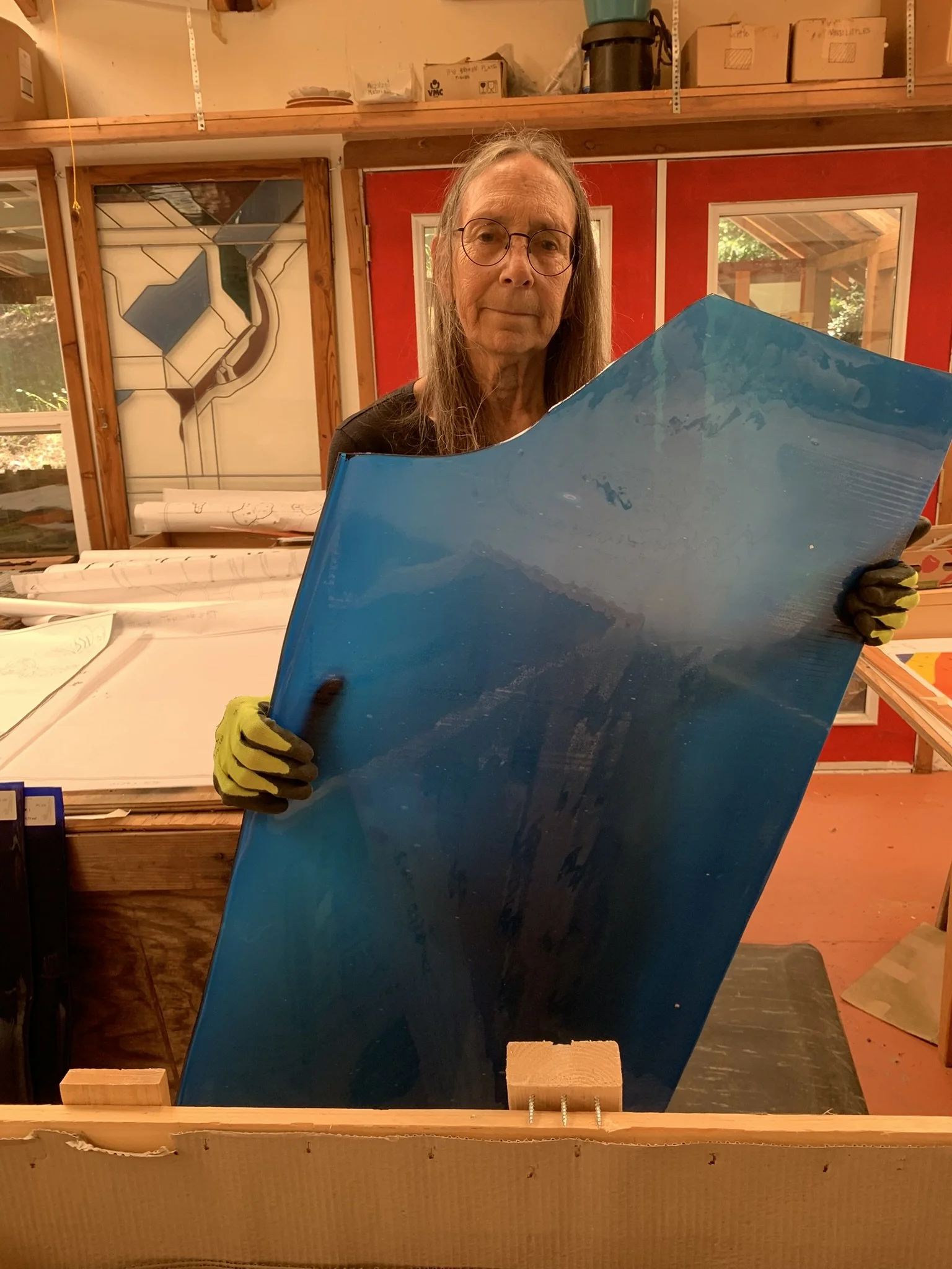  Michelle unloads the glass from the crate 