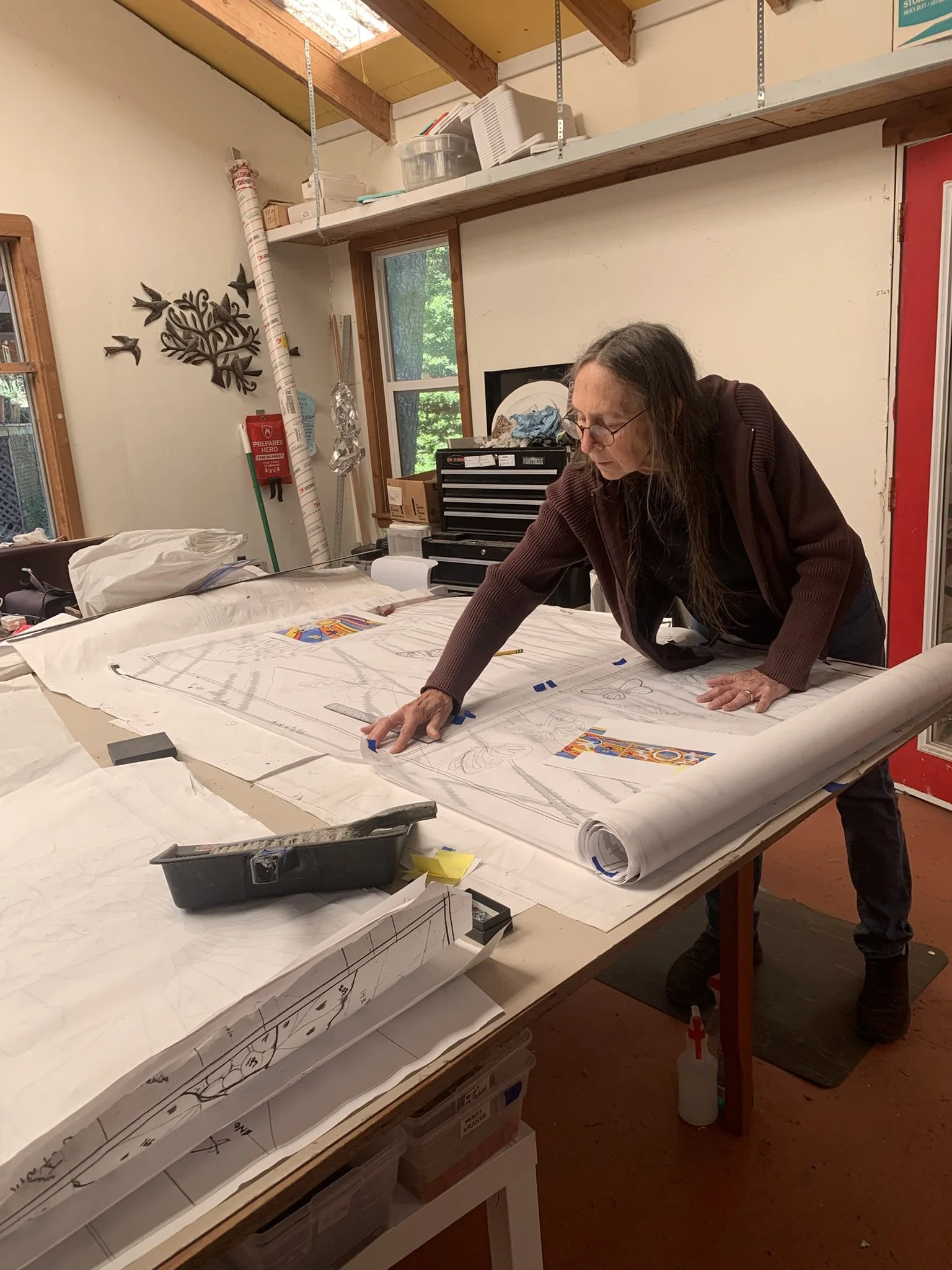  Michelle works on laying out the next panel for fabrication 