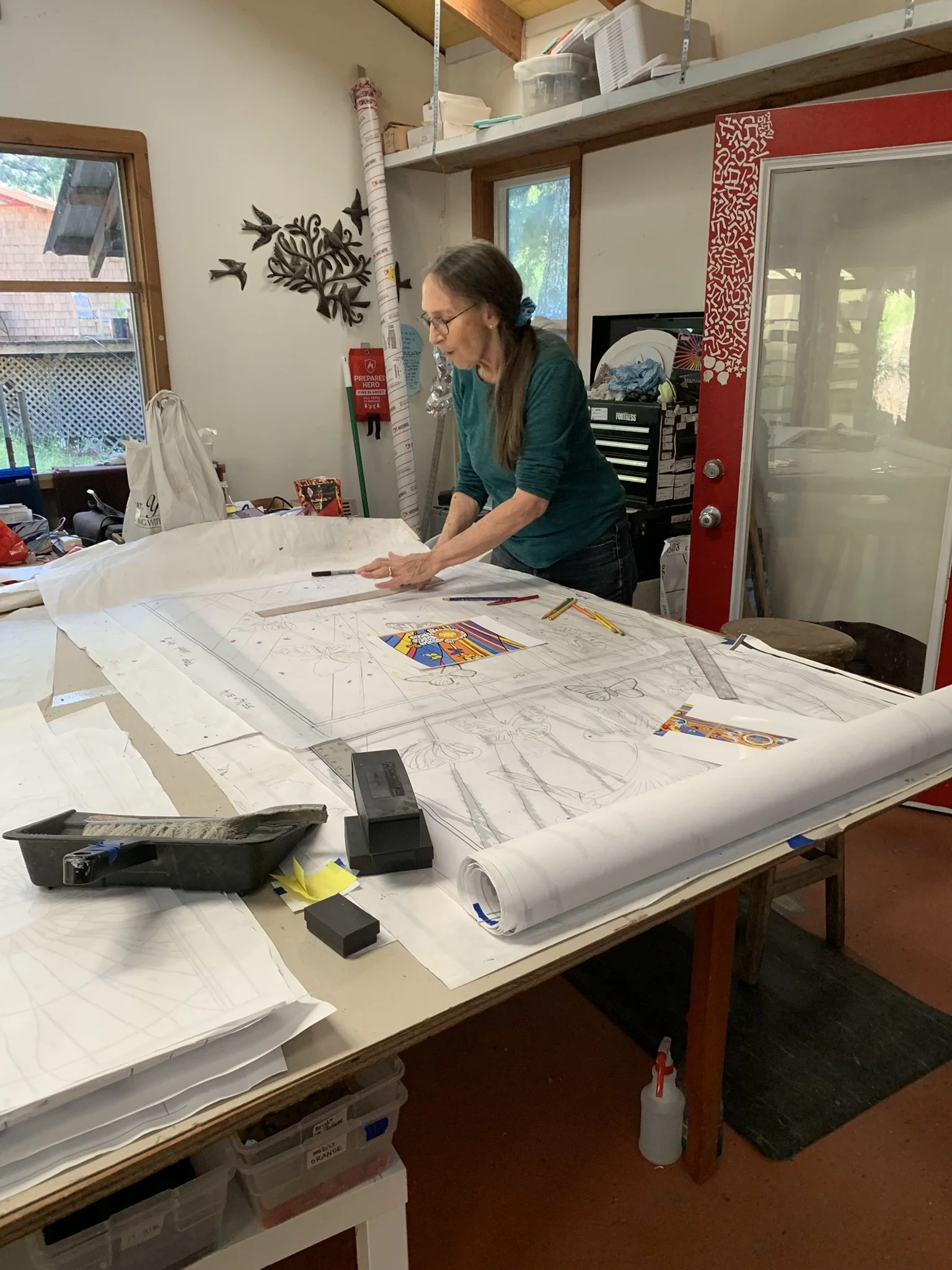  Michelle works on the pattern for the butterfly panel 