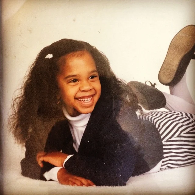 I can only imagine the boxing match my mom endured to get me to smile while wearing this number...