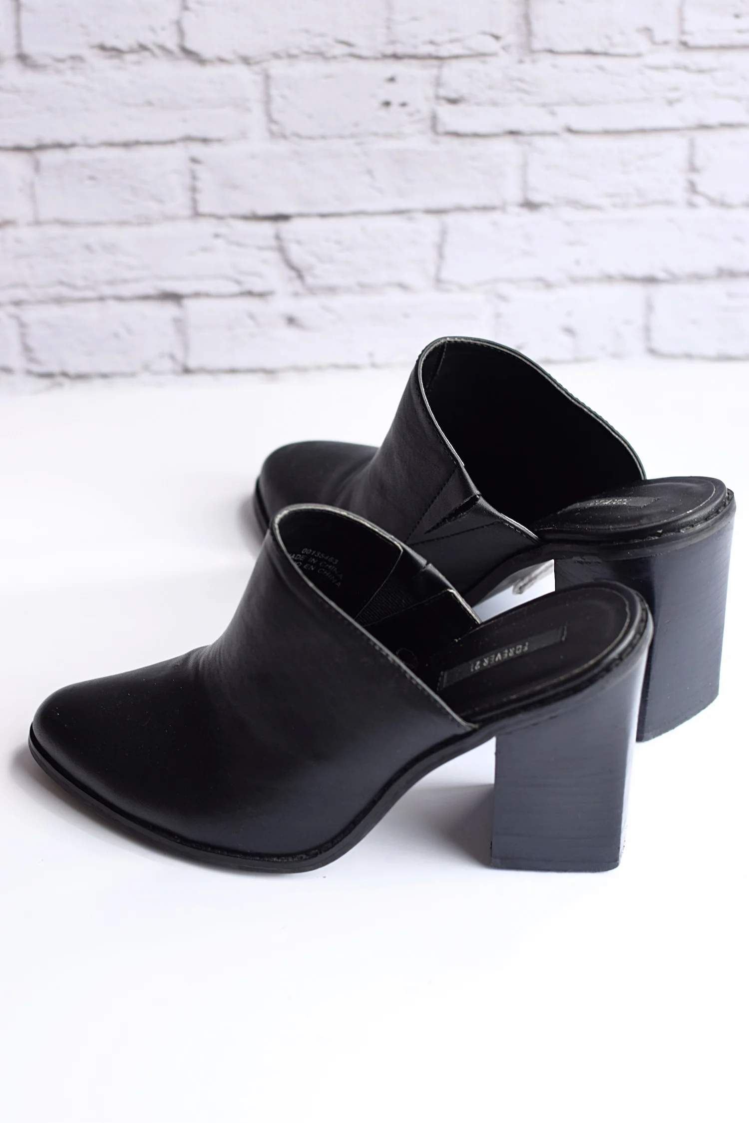 black closed toe mules