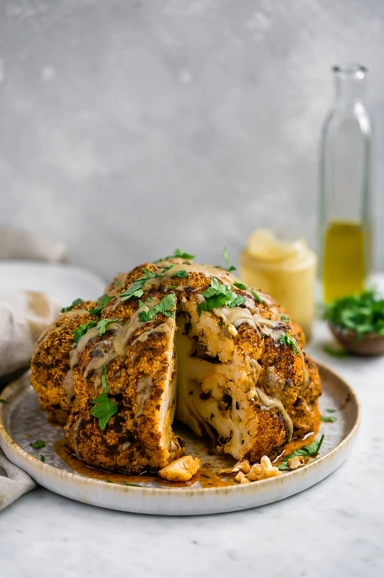 Whole Roasted Cauliflower with Tahini Sauce | Truffles and Trends