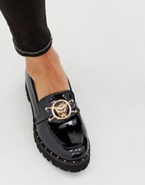 Glamorous black chunky flat shoes with gold lion trim