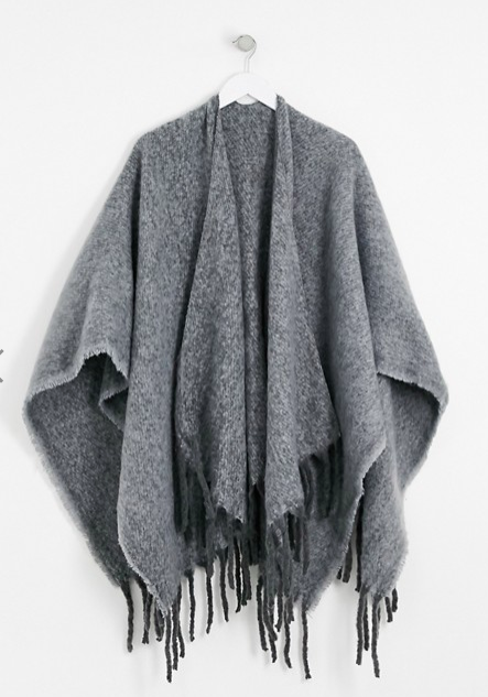 ASOS DESIGN cape in 2 tone fluffy yarns with tassels