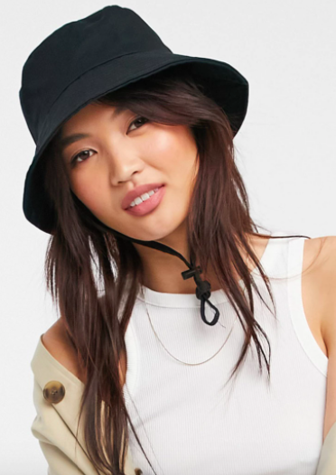 ASOS DESIGN canvas bucket hat with toggle detail in black