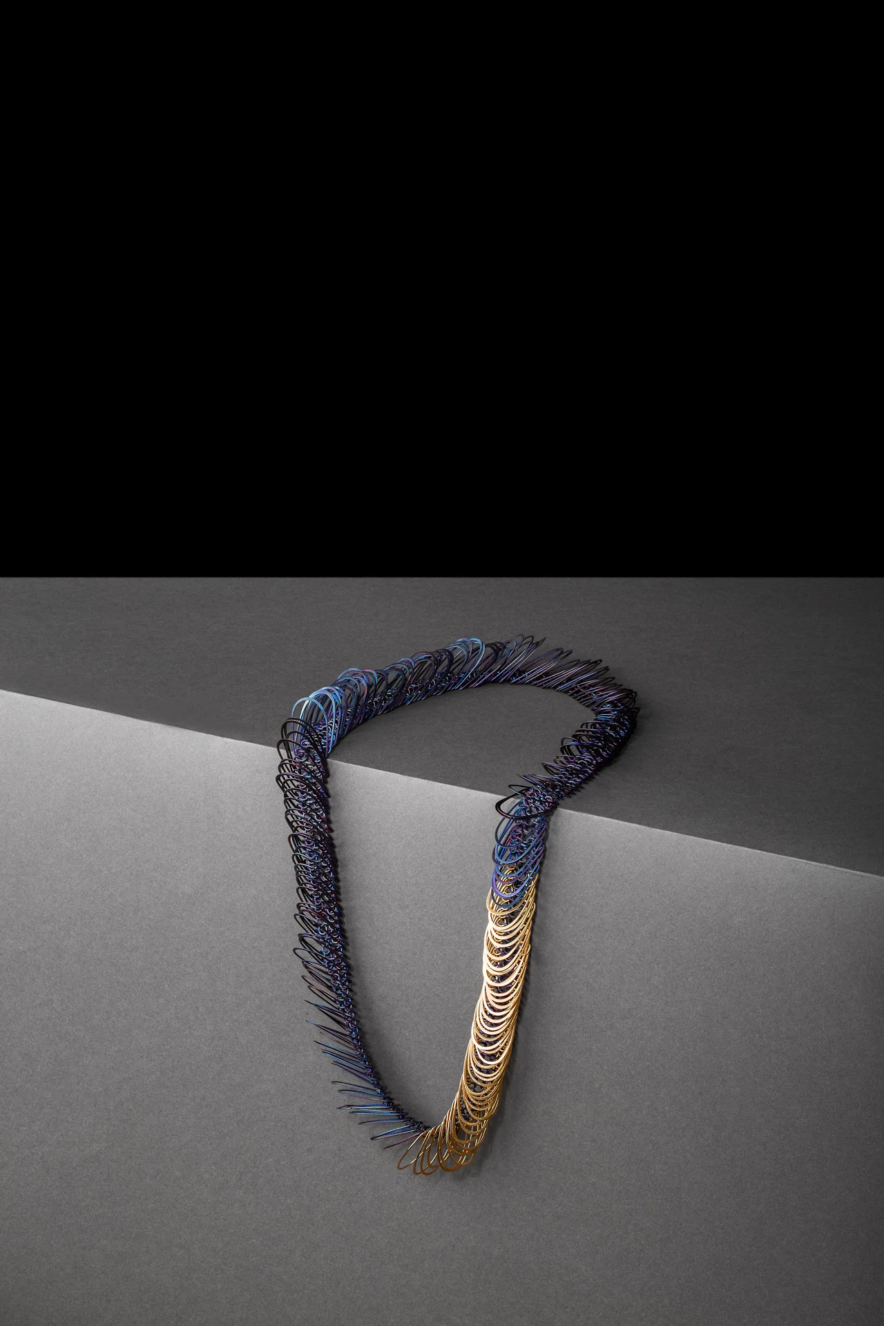 Slinky Necklace in Titianium and Gold. Cheongju Craft Bienalle, South Korea.