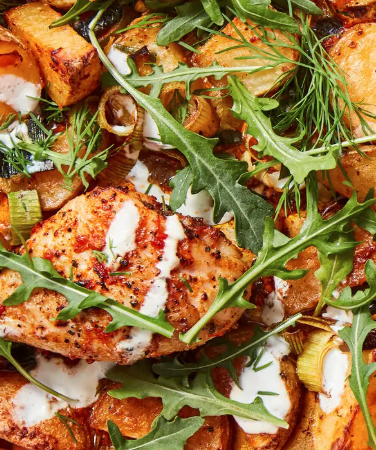 October 29th: Melissa Clark’s Sheet-Pan Chicken Thighs with Potatoes, Arugula, and Garlic Yogurt Sauce