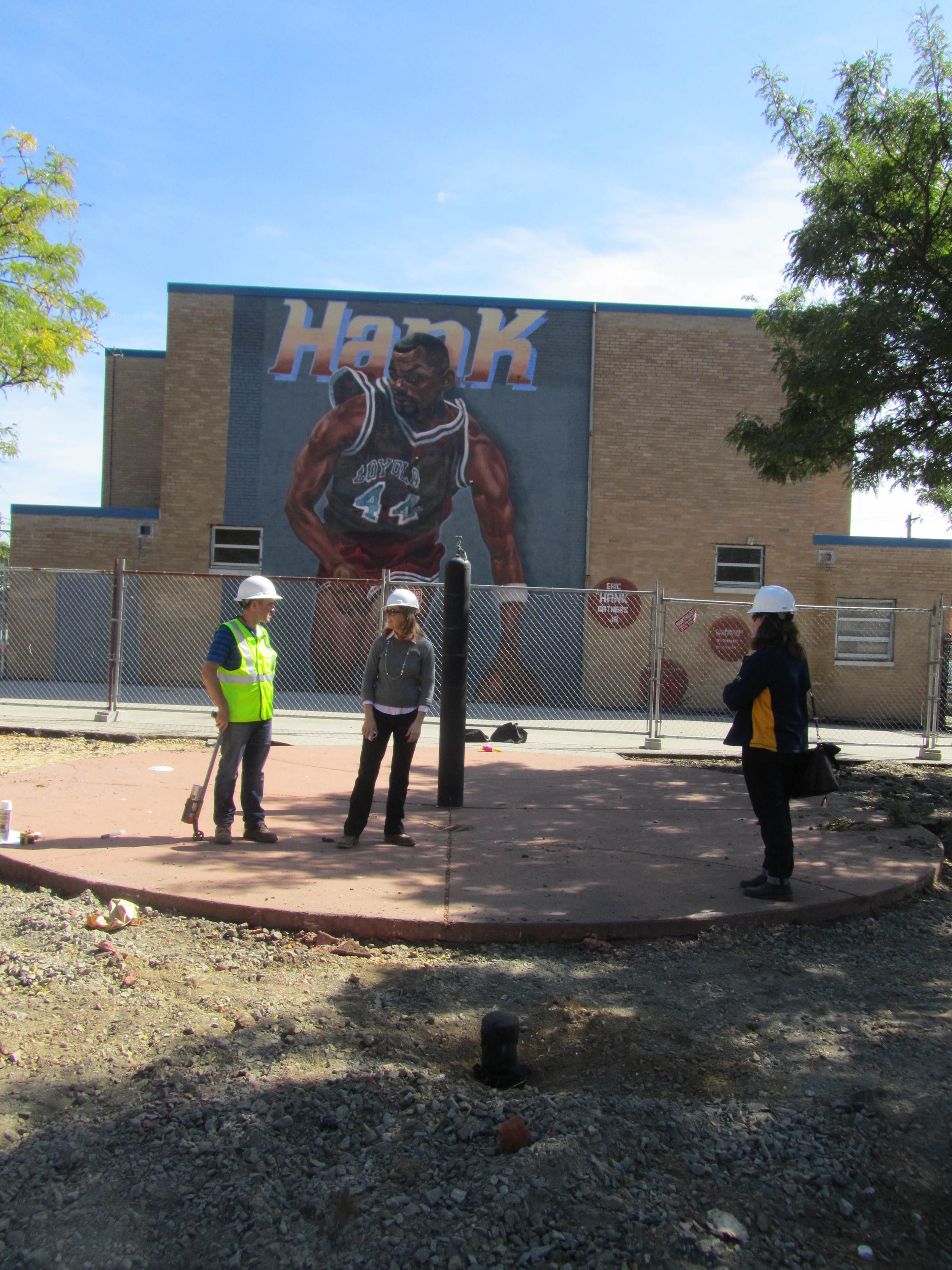 Project team members gather near new spray ground.
