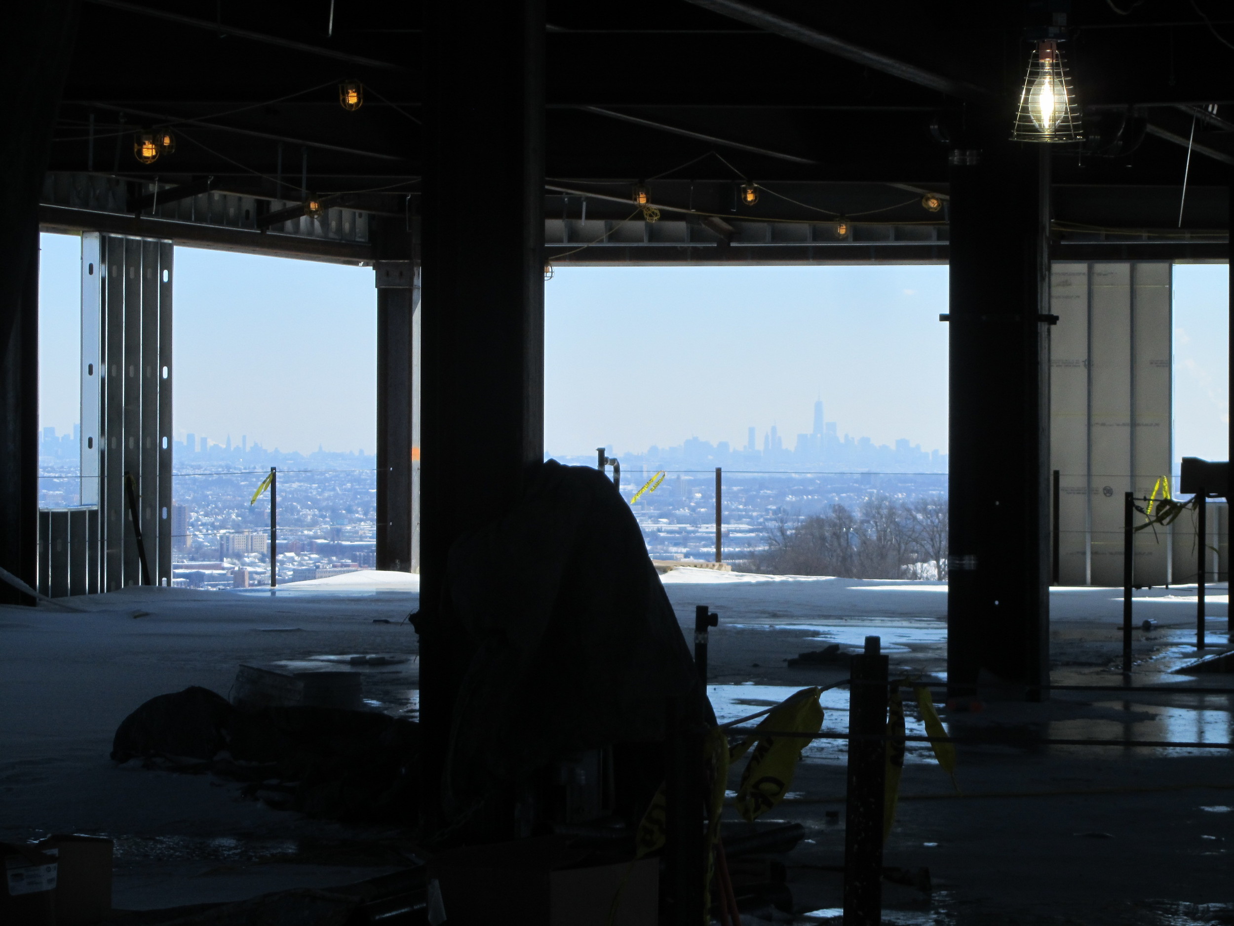 View of NYC skyline from top floor of New Academic Building
