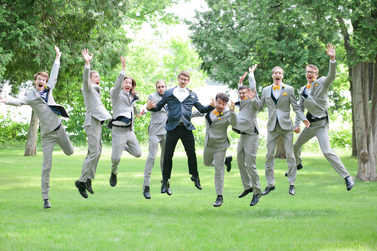 fun groomsmen jumping wedding photo