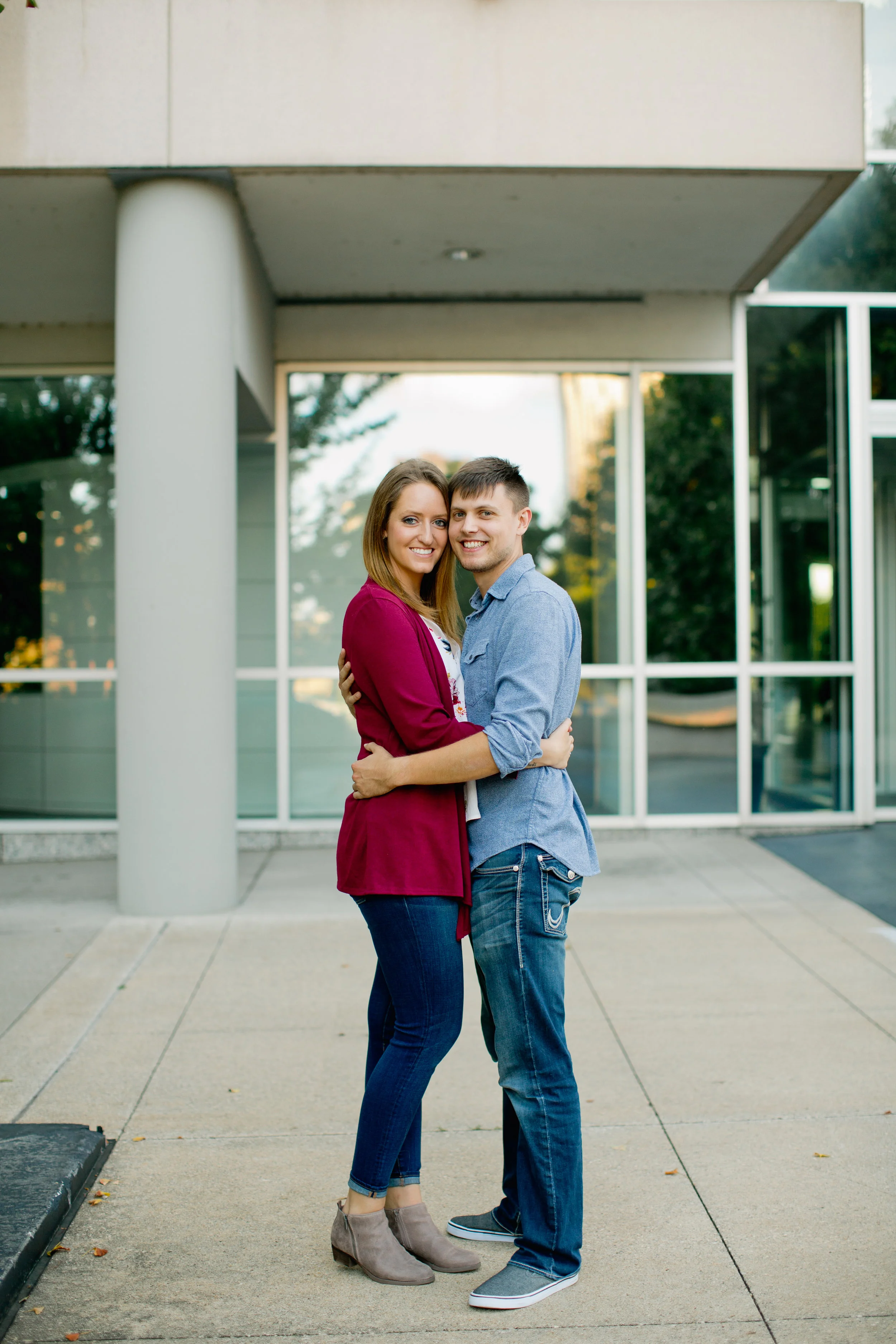 Pella Central College engagement photos // couple hugging in fall attire