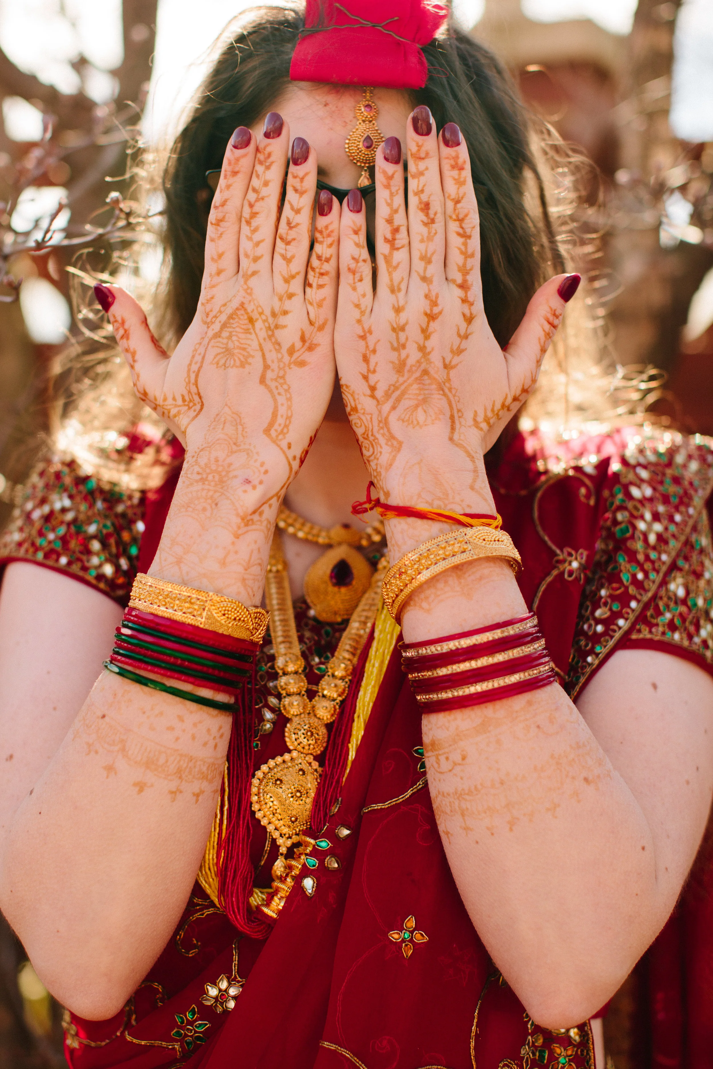 bride with henna on hands hindu nepali wedding