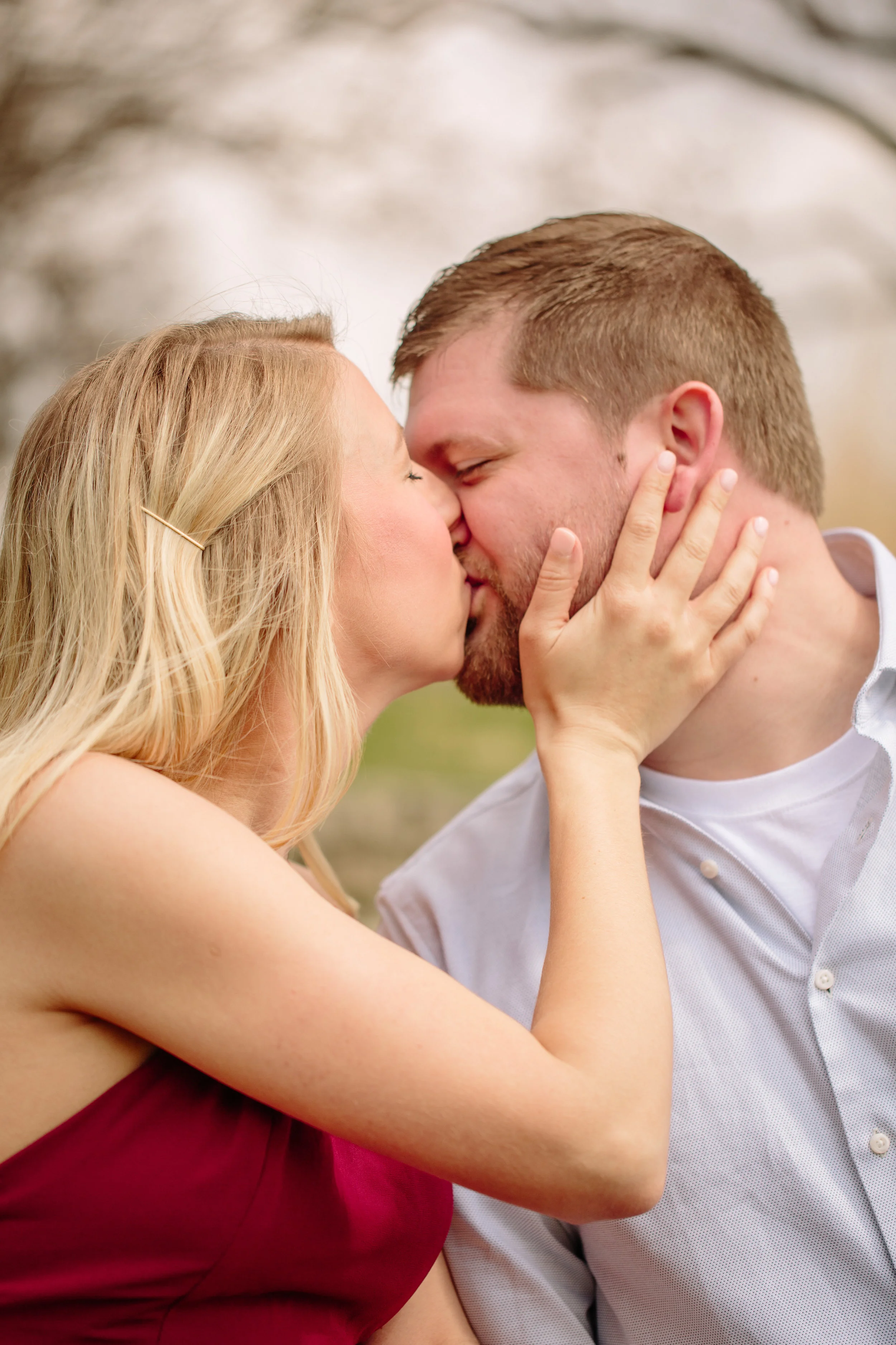 kissing with hands on face engagement photos Des Moines IOwa amelia renee